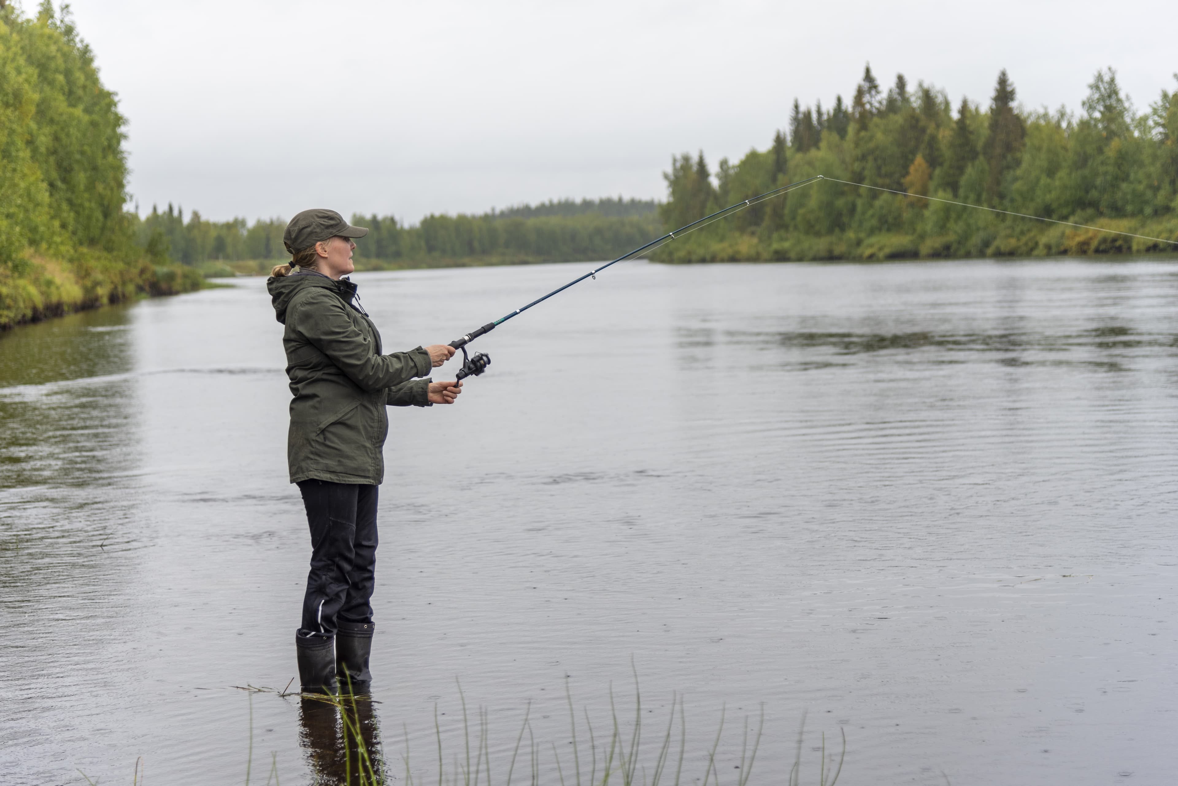 Woman fishing on river