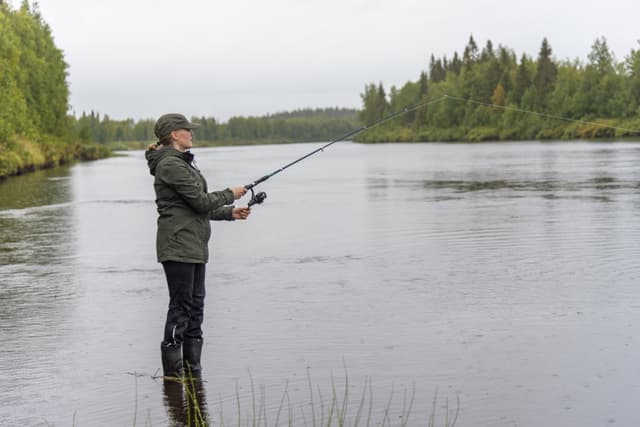 Woman fishing on river