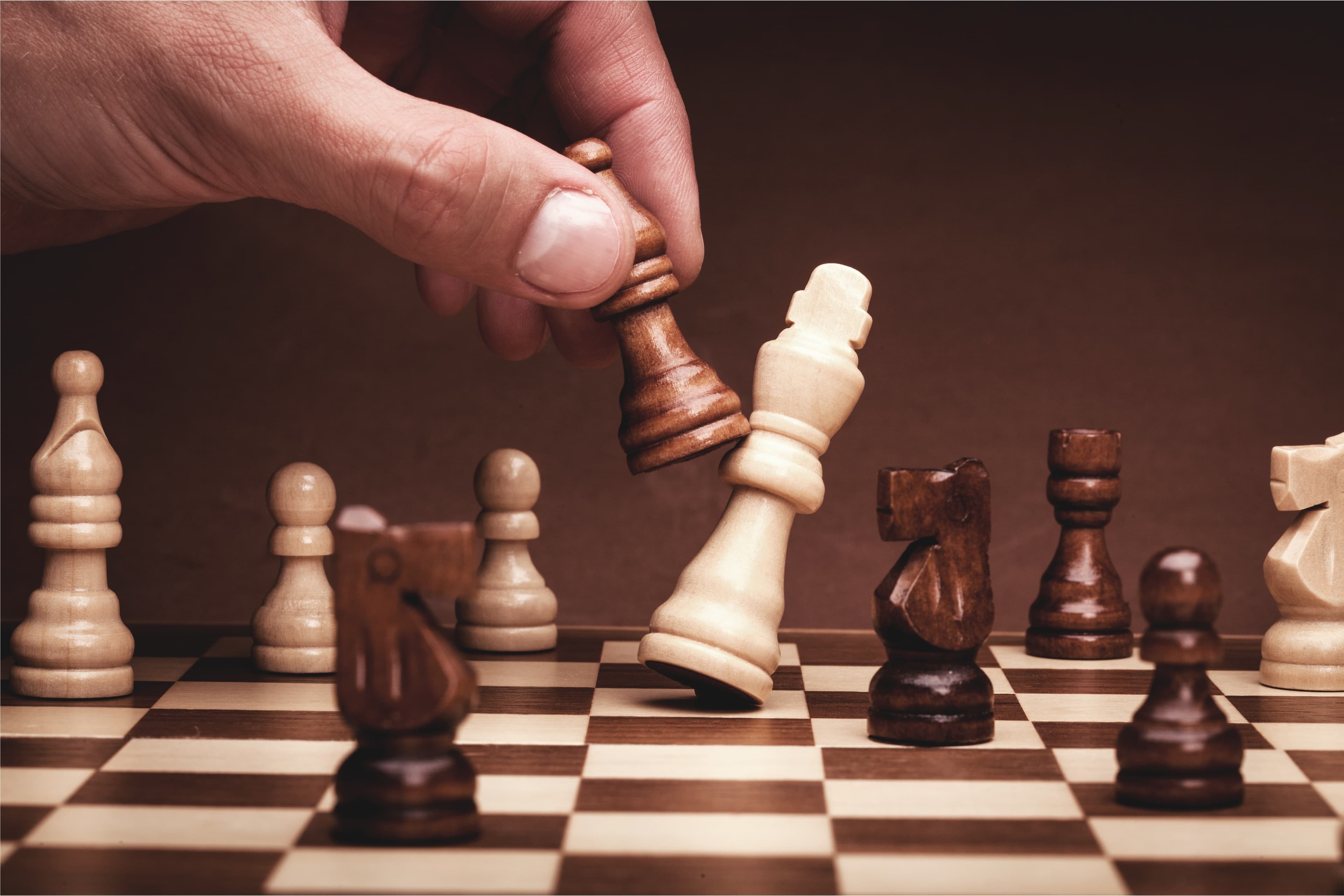 Businessman playing chess close up