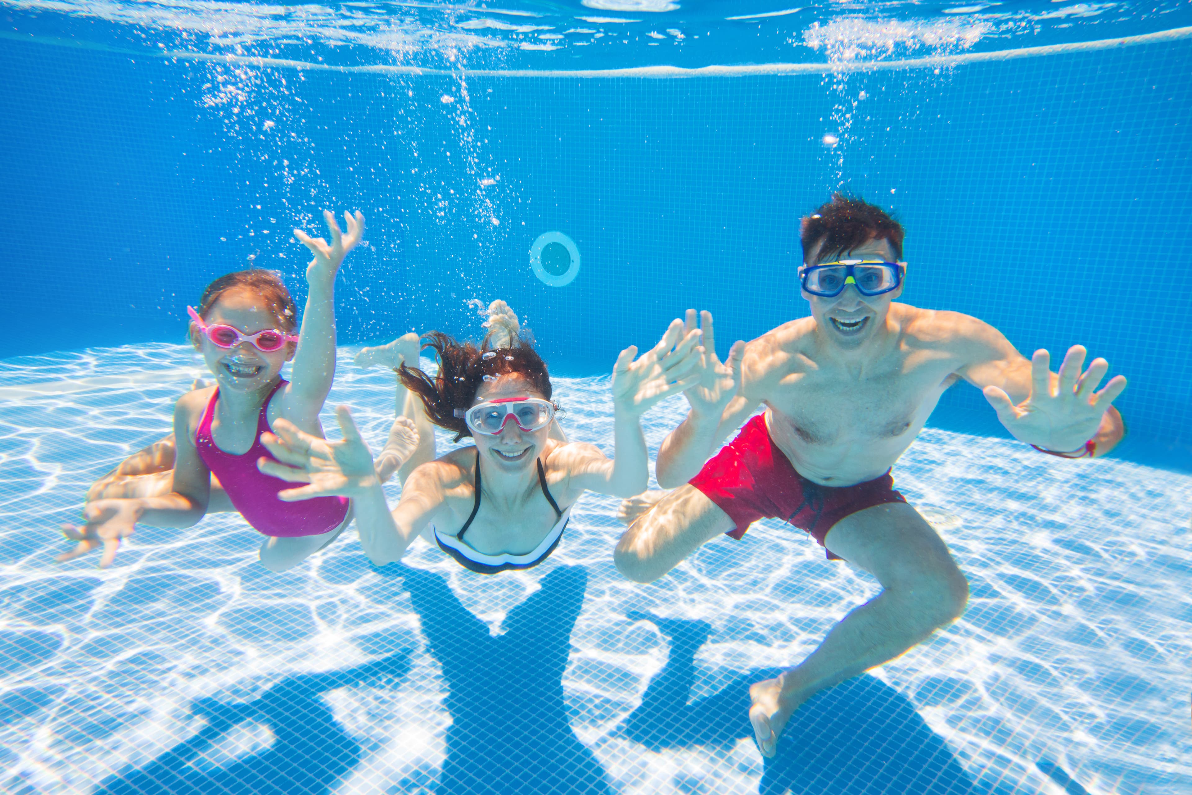 family  in swimming pool