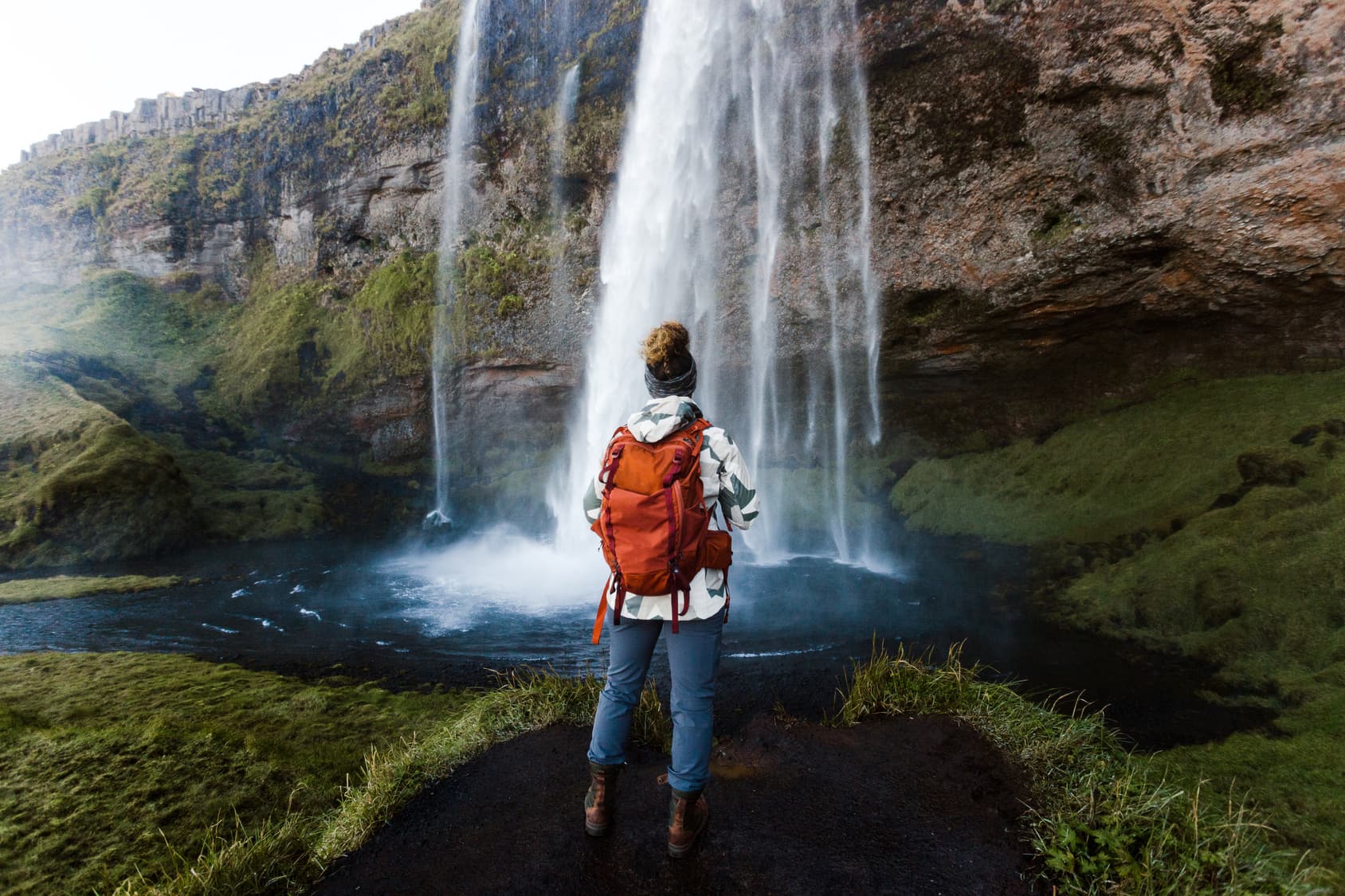woman-behind-waterfall-celand