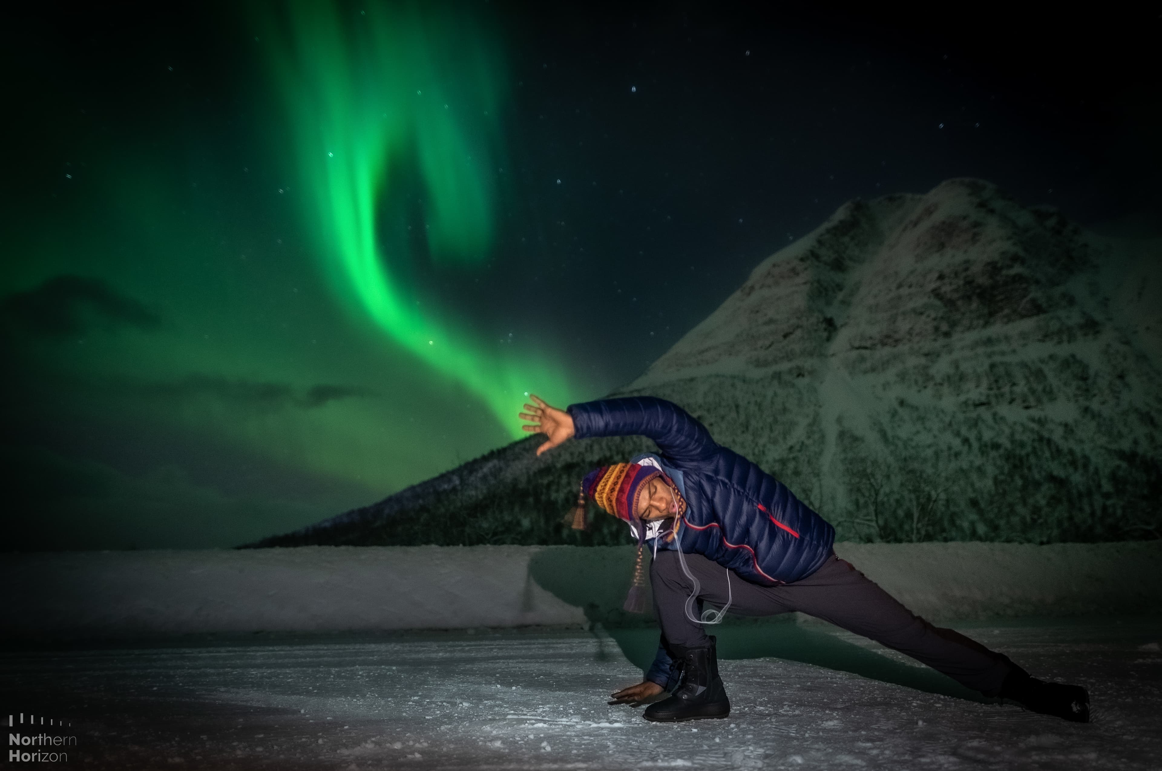 Man-posing-by-northern-lights