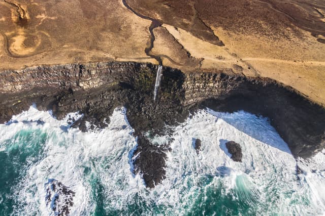 Waterfall falling to the sea