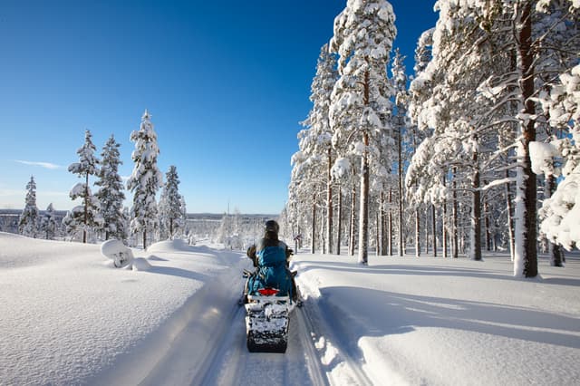 Traveling Lapland with snowmobile