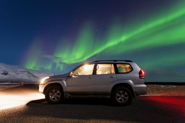 northern-lights-above-vehicle