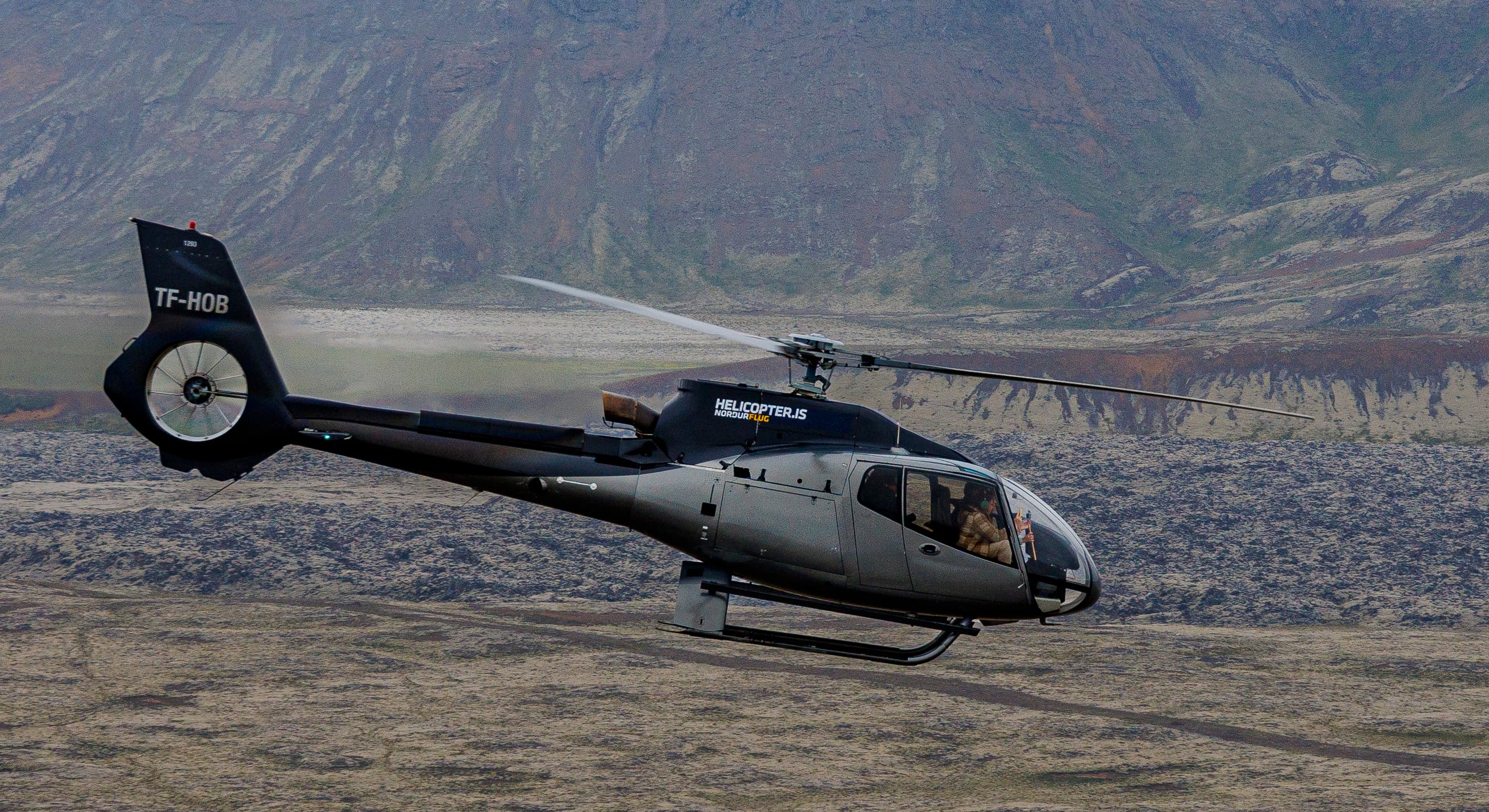 Helicopter-flying-above-lava-fields