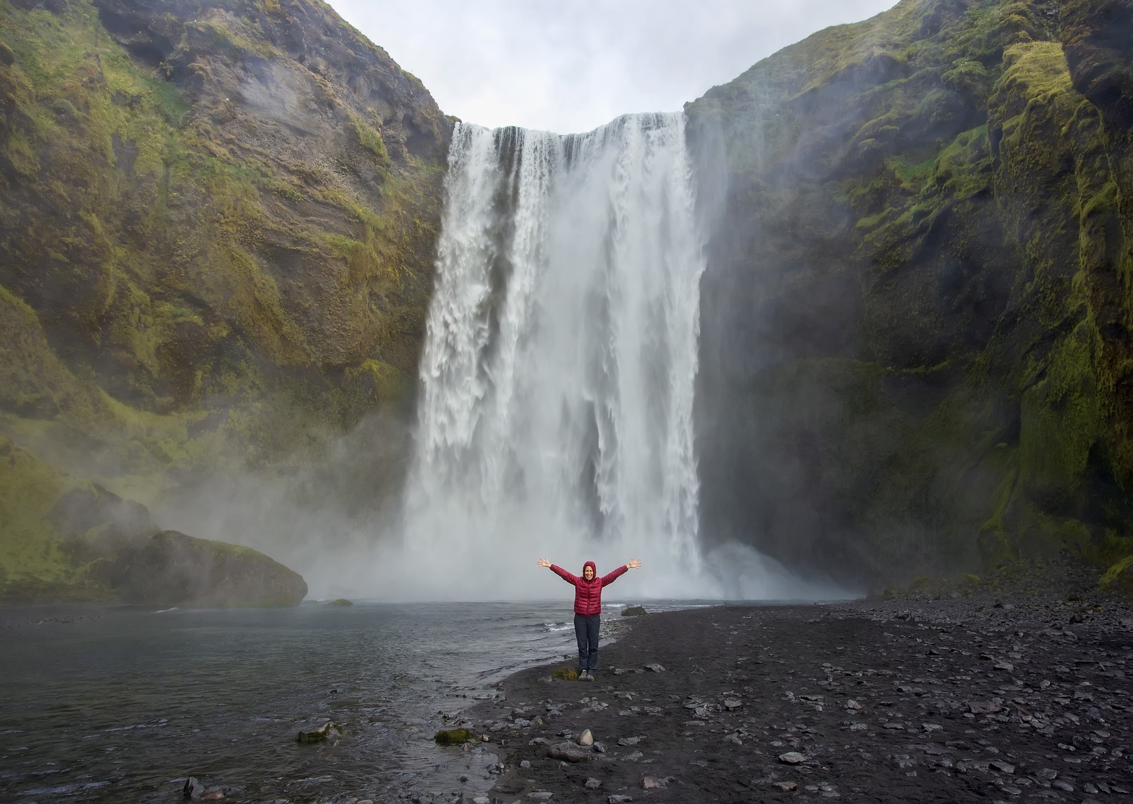Tourist at Skógafoss waterfall