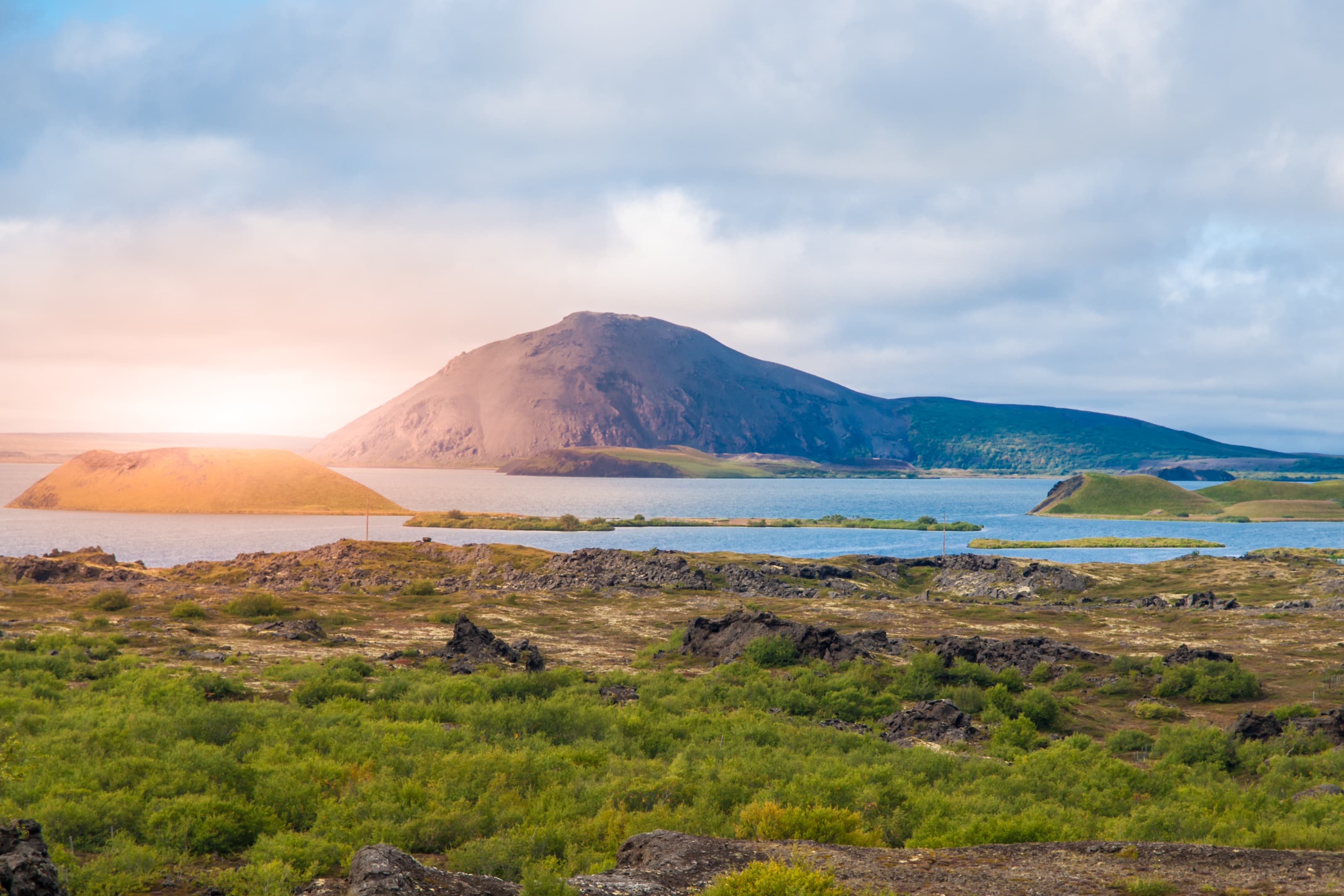 Sunset time in volcanic landscape at Myvatn Lake, aka Lake of mosquitos, northern Iceland. sunset-time-volcanic-landscape-iceland