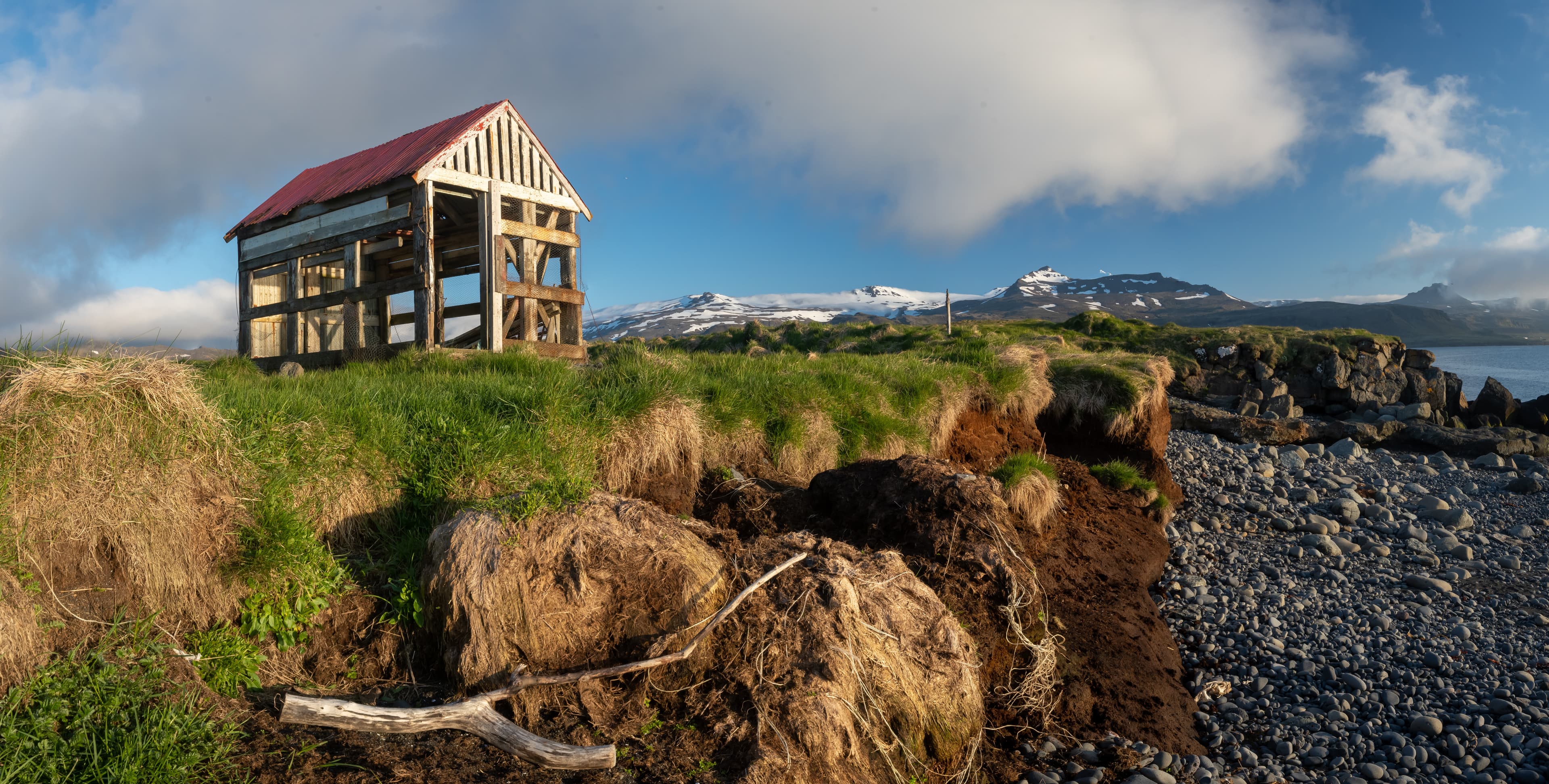 Iceland Fish Shed on Beach with Mountains