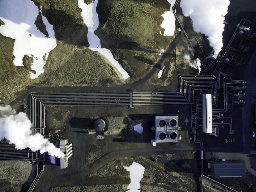 Aerial photograph of Hellisheidi geothermal powerplant in iceland, shot in springtime with snow on the ground close by Aerial of hellisheidi powerplant Iceland