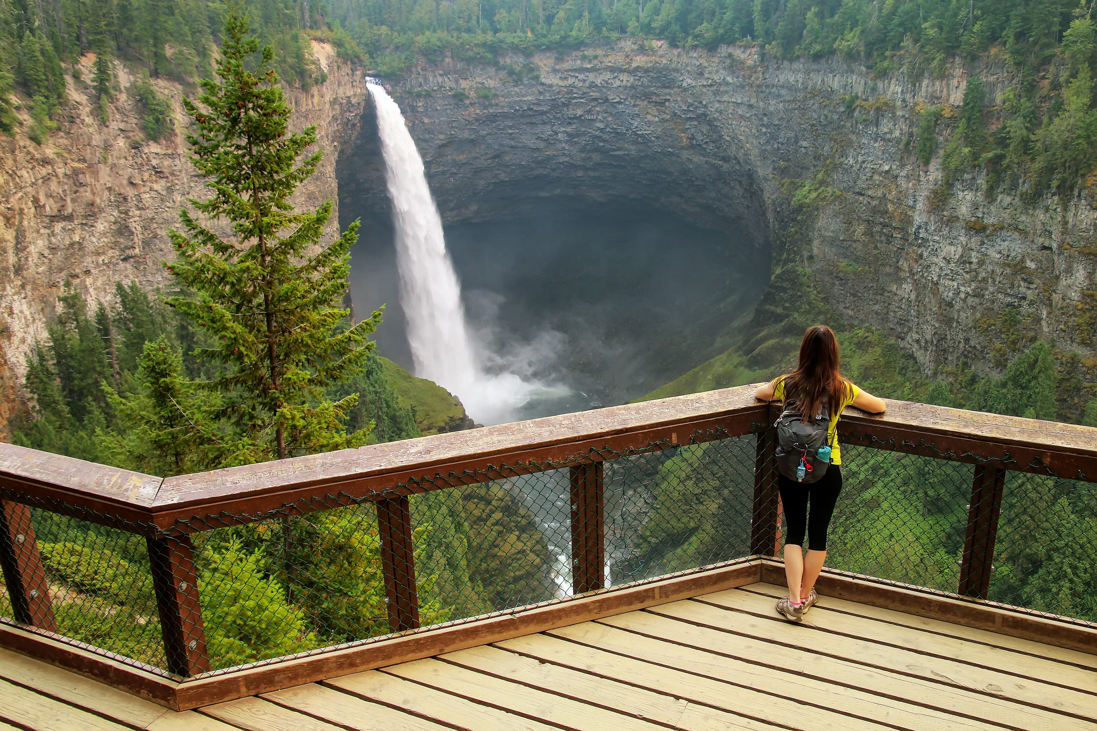 Tourist looking at Helmcken Falls in Wells Gray Provincial Park, British Columbia, Canada. It is fourth largest park in British Columbia. British Columbia Region 06
