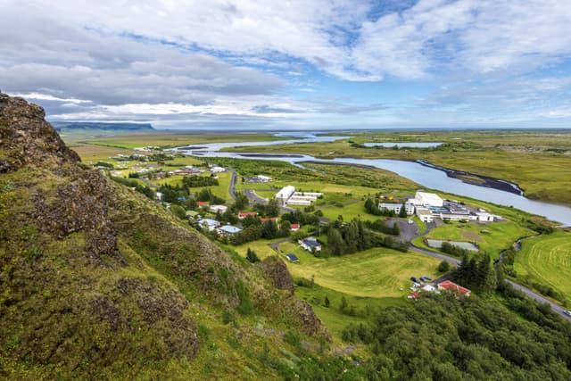 Kirkjubaejarklaustur village in Skaftarhreppur municipality of Southern Iceland. The flow of Skafta river to rejoin the Atlantic Ocean at horizon.  Kirkjubaejarklaustur village in Skaftarhreppur municipality of Southern Iceland.