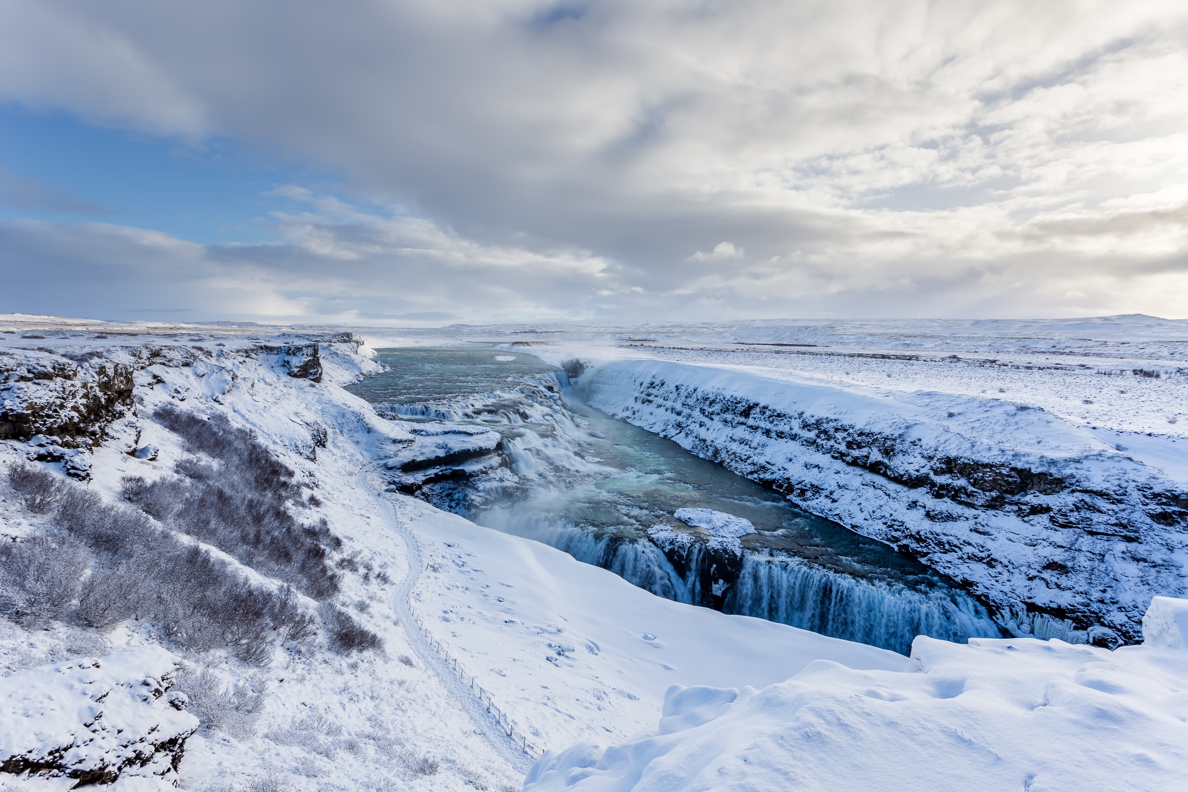 Iceland-Gullfoss-waterfall-surrounded-by-snow-during-winter-season