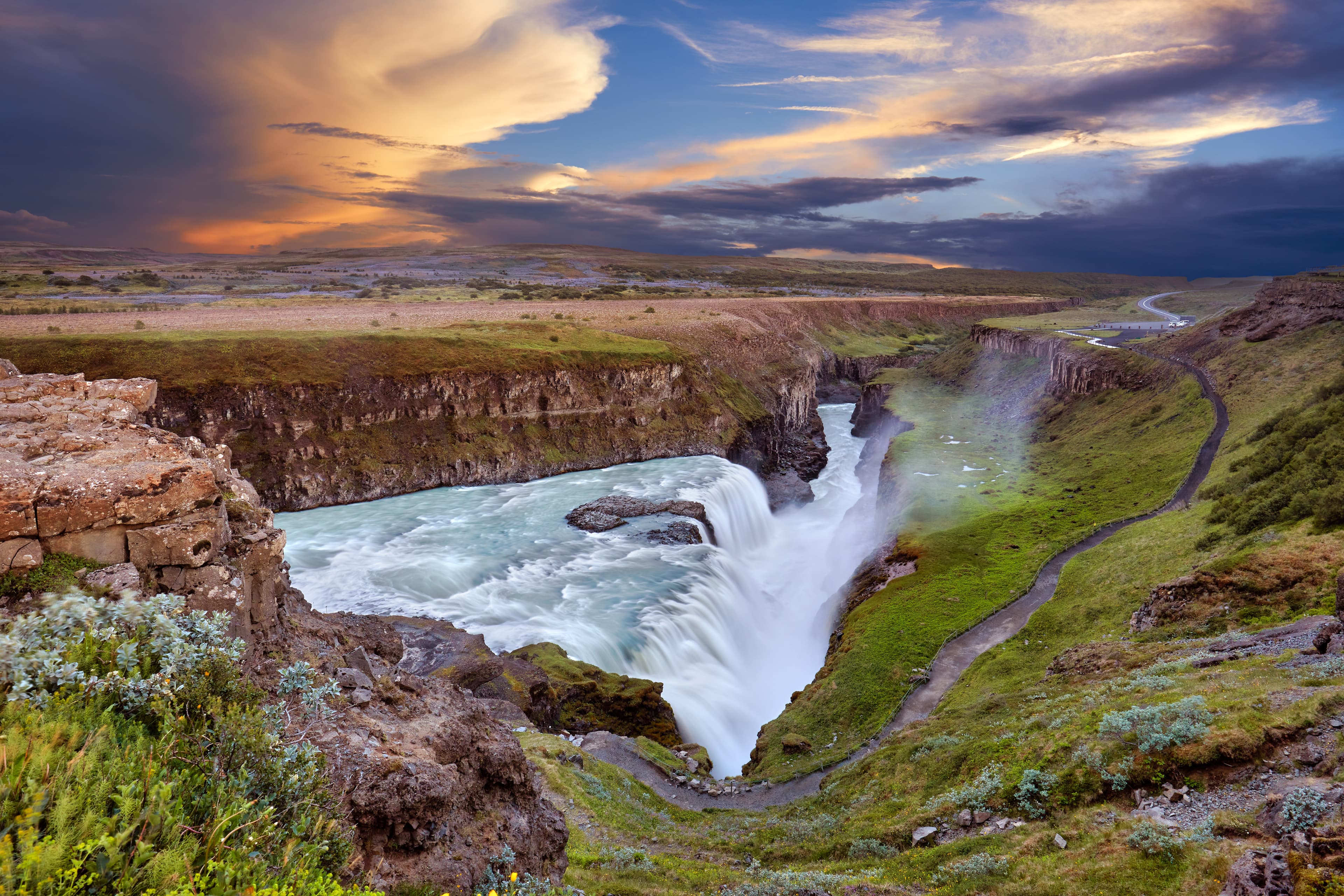 Panoramic view on Gullfoss waterfall on the Hvíta river, a popular tourist attraction and part of the Golden Circle Tourist Route in Southwest Iceland. Golden Waterfall. Travelling concept background. Panoramic view on Gullfoss waterfall on the Hvíta river, a popular tourist attraction and part of the Golden Circle Tourist Route in Southwest Iceland. Golden Waterfall. Travelling concept background.