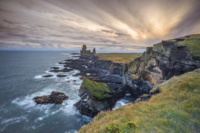 Londrangar basalt rock monolith at the southcoast of Snaefellsness peninsula in western Iceland, landscape photography