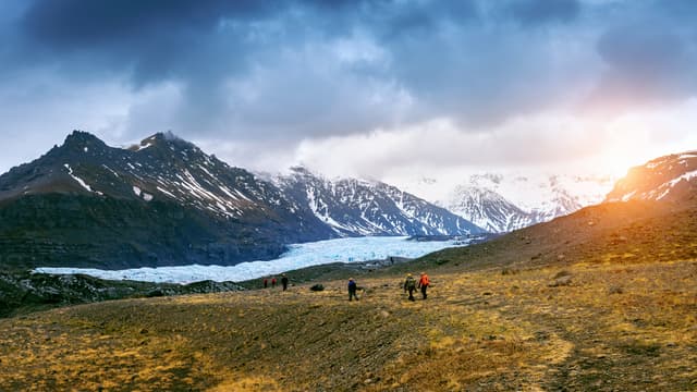 Tourist taking in Skaftafell glacier, Vatnajokull National Park in Iceland. Tourist taking in Skaftafell glacier, Vatnajokull National Park in Iceland.