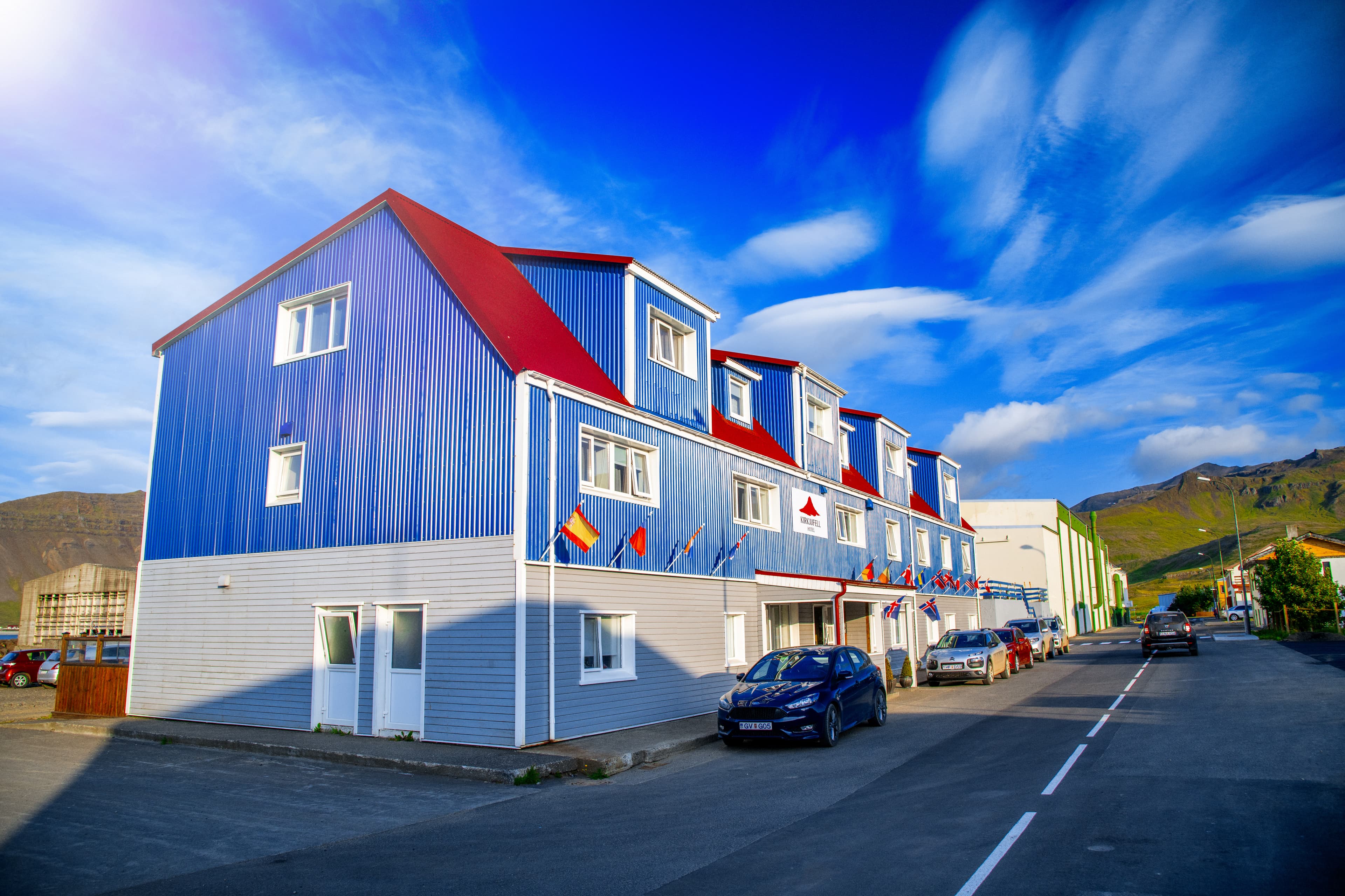 GRUNDARFJORDUR, ICELAND - AUGUST 8, 2019: Grundarfjordur colourful homes on a summer sunset. GRUNDARFJORDUR, ICELAND - AUGUST 8, 2019: Grundarfjordur colourful homes on a summer sunset