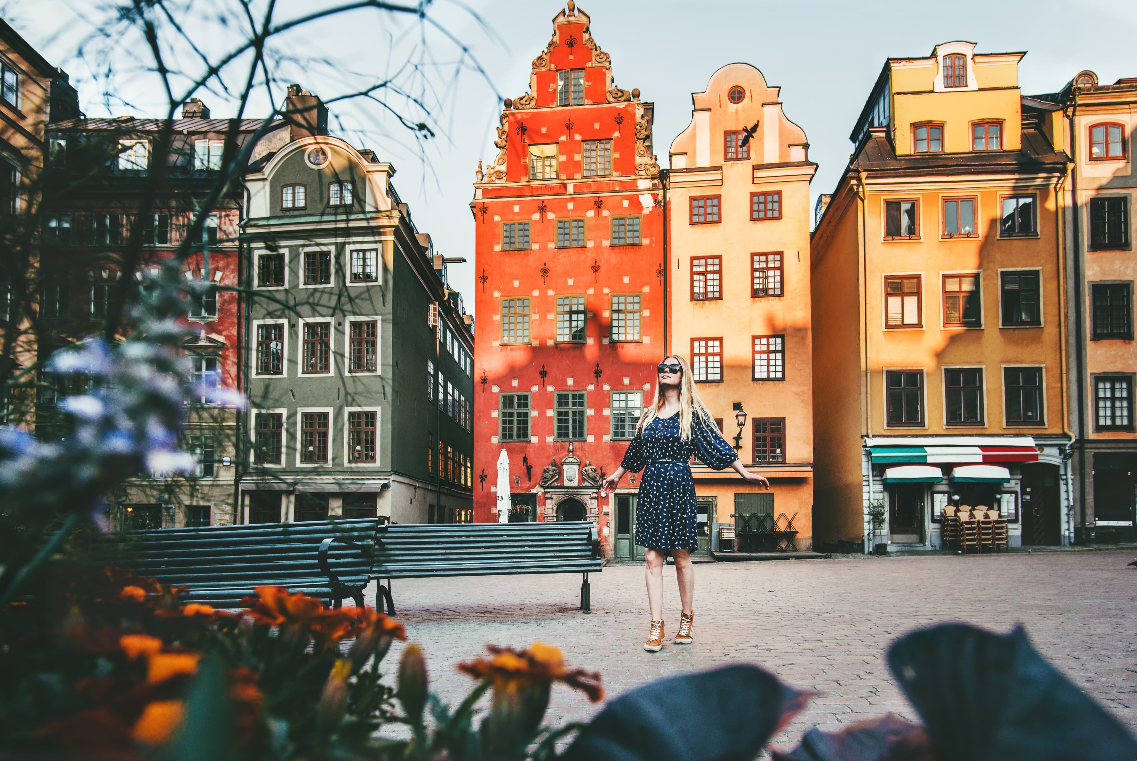 Young woman traveling in Stockholm sightseeing Gamla Stan Stortorget architecture lifestyle summer vacations in Sweden  Young woman traveling in Stockholm sightseeing Gamla Stan Stortorget architecture lifestyle summer vacations in Sweden