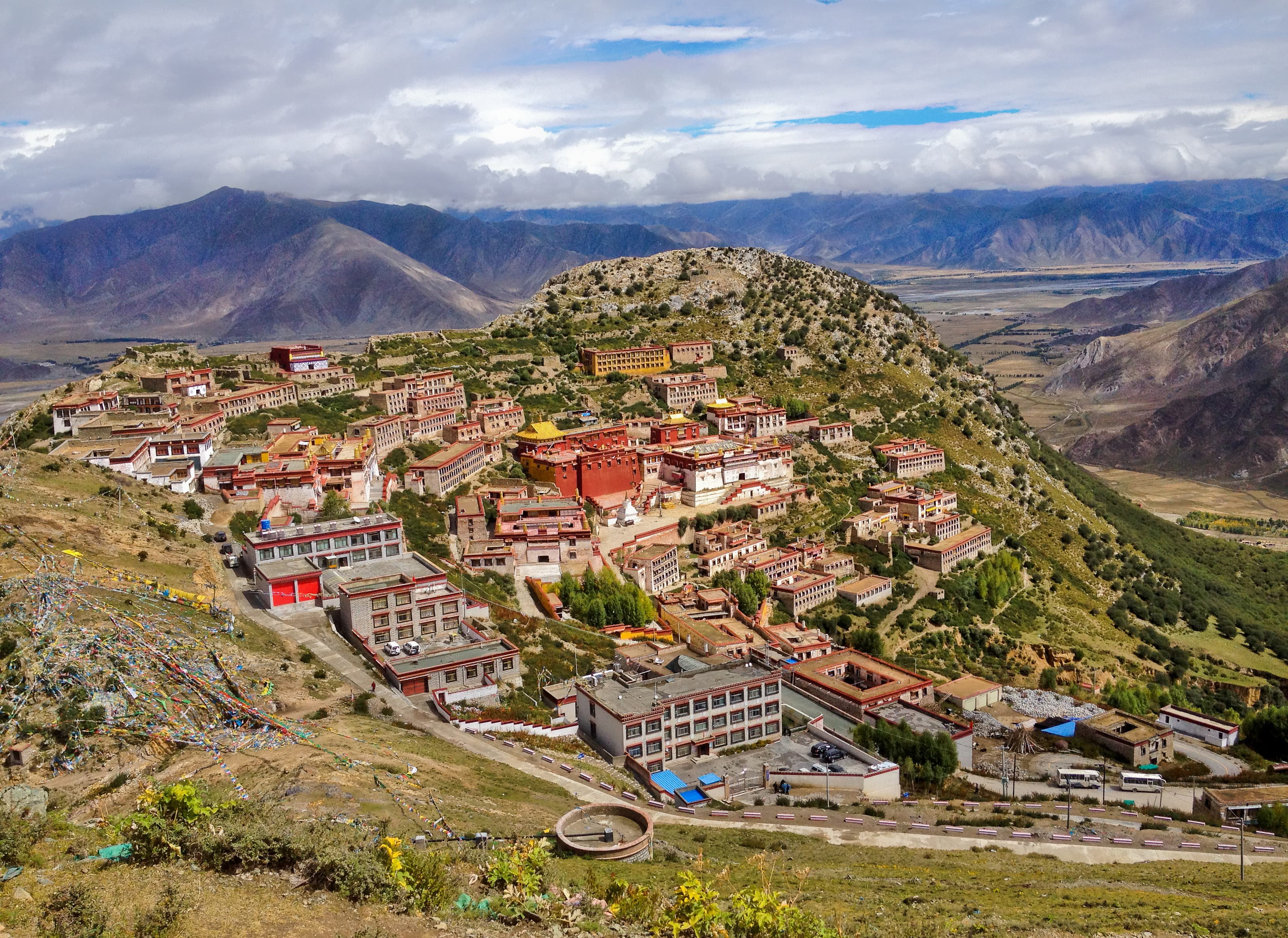 Tibetan Ganden Buddhist Monastery lies in a hilly natural amphitheater Mountains and dramatic views over the valleys near Lhasa, Tibet. The place for meditation and pilgrimage, hermitage or retreat. Tibetan Ganden Buddhist Monastery lies in a hilly natural amphitheater Mountains and dramatic views over the valleys near Lhasa, Tibet. The place for meditation and pilgrimage, hermitage or retreat.