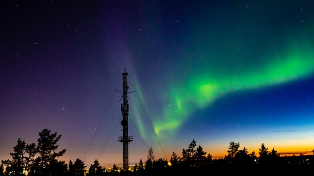 OLYMPUS DIGITAL CAMERA Northern lights scenery above Rovaniemi Finland with transmitter