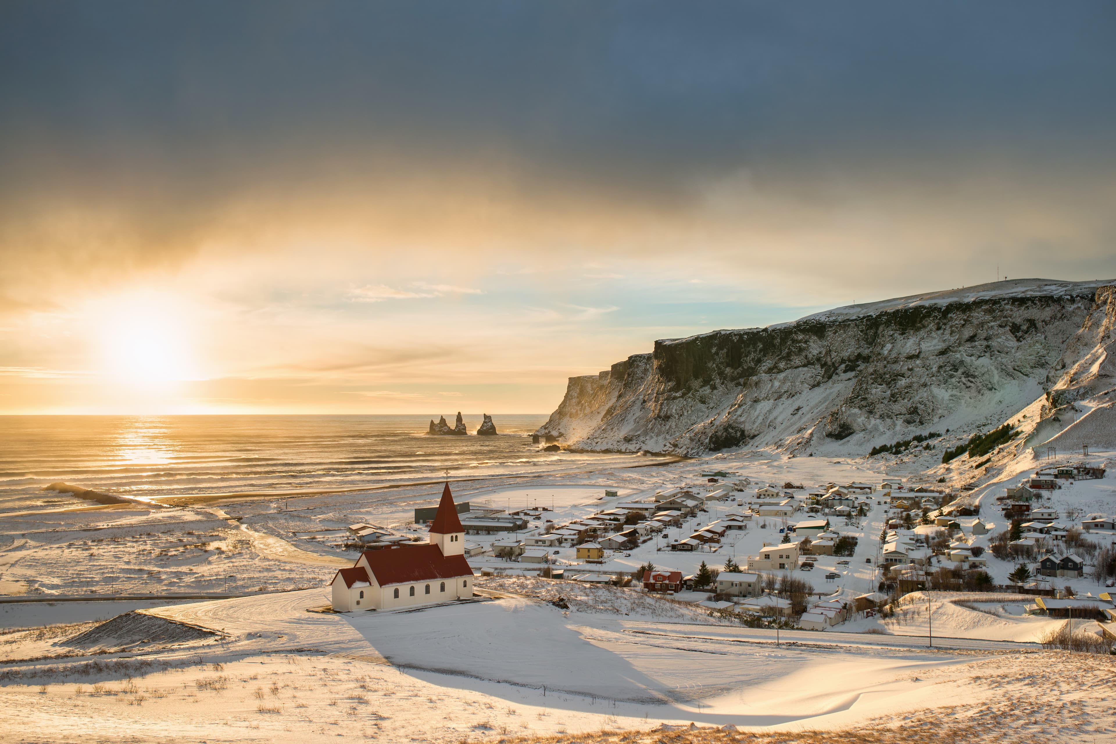 Vik-near-Reynisfjara-coast-and-the-mountains-in-winter-Iceland-in-the-sunny-day