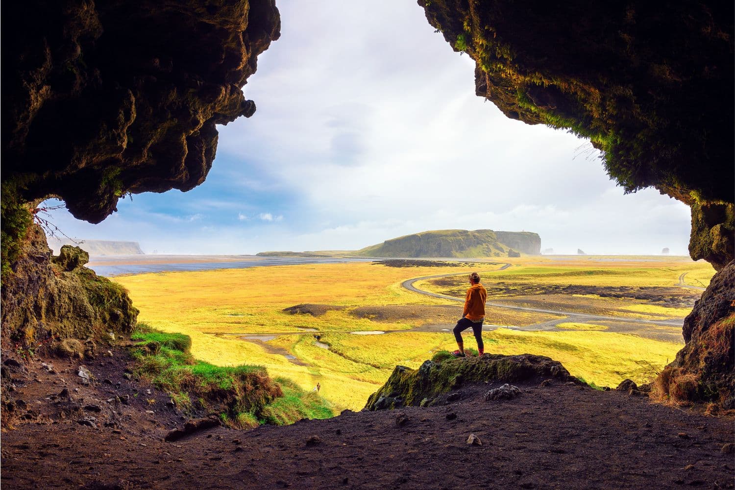 man-standing-at-entrance-loftsalahellir-cave IN CONTENT