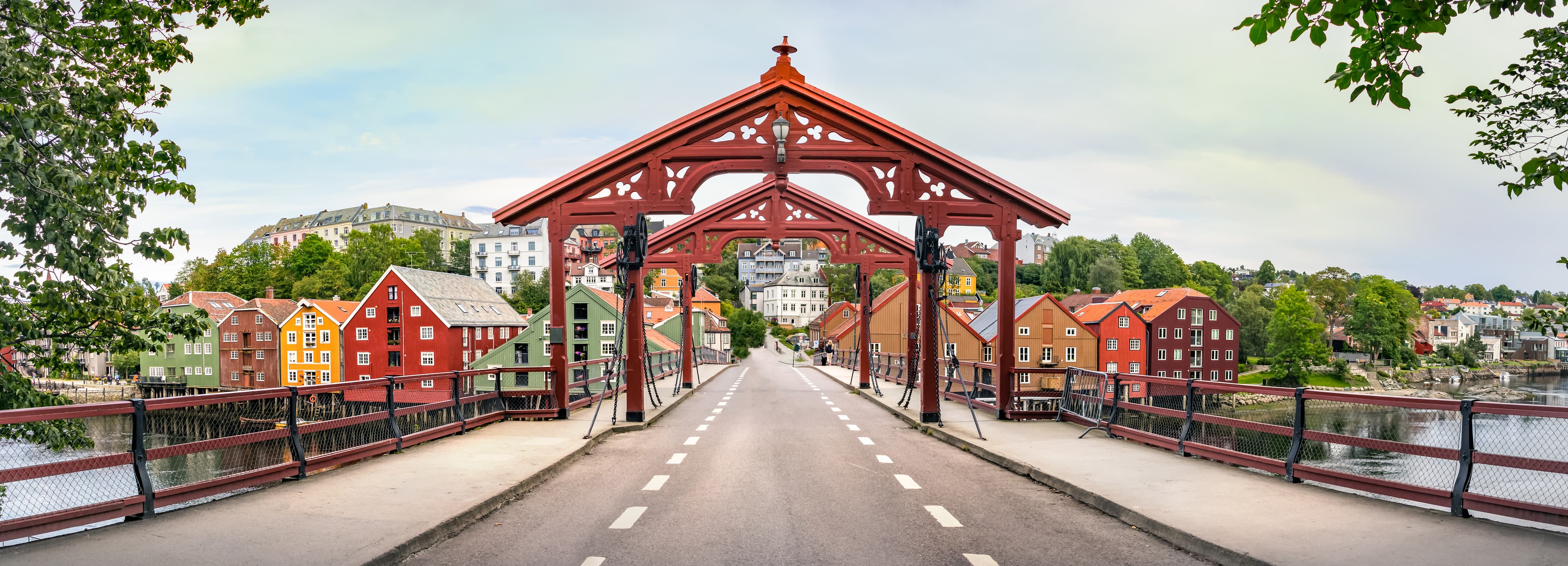The Old Town Bridge or Gamle Bybro of Trondheim with their colorful houses and the Nidelva River, Norway. Panorama of the Old Town Bridge or Gamle Bybro of Trondheim, Norway.