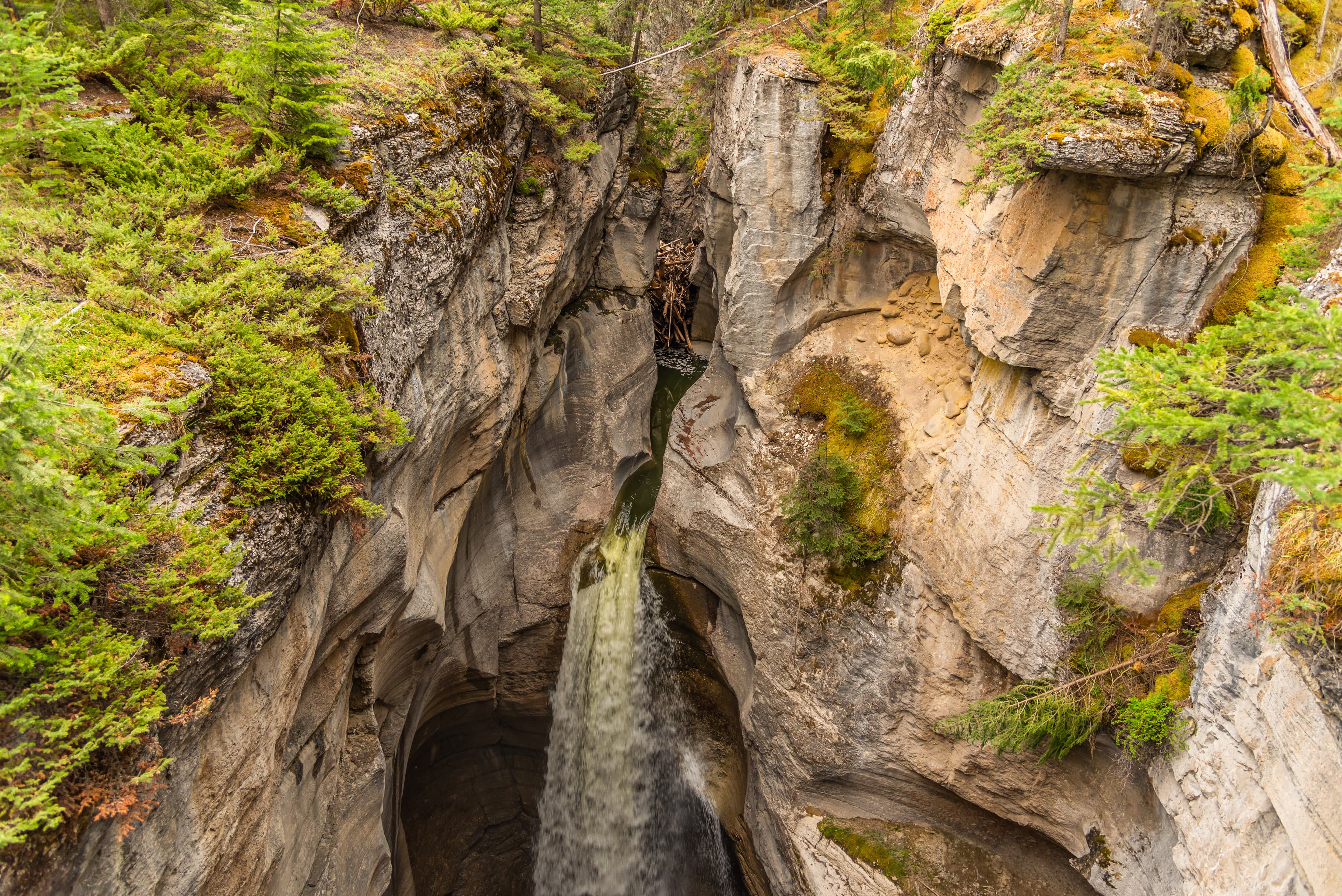 Incredible Maligne Canyon in Jasper National Park during spring time with unreal scenic Canadian views in the Rockies of Canada. Scenic nature view in popular tourism, tourist spot.