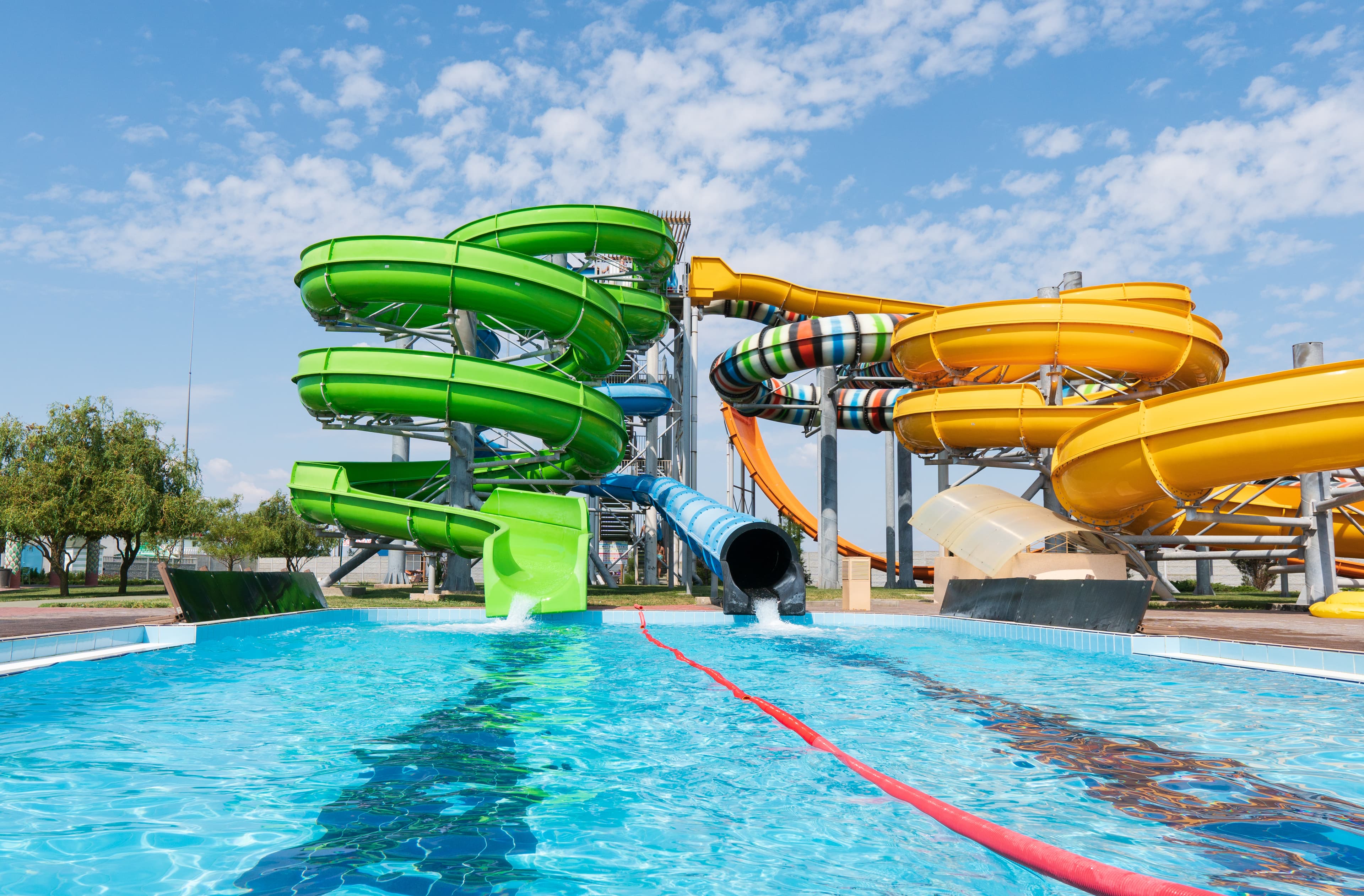 Water park with colorful slides and pools. Water park with colorful slides and pools