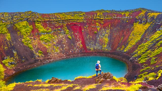 Famous colorful and dangerous Kerid volcanic crater with lake inside on Iceland during sunset Famous colorful and dangerous Kerid volcanic crater with lake inside on Iceland during sunset, summer time
