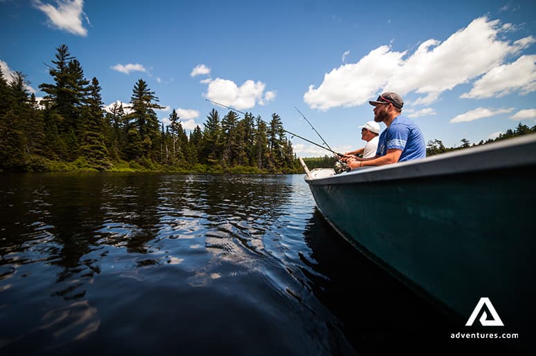 father-and-son-fishing-on-the-boat-in-canada