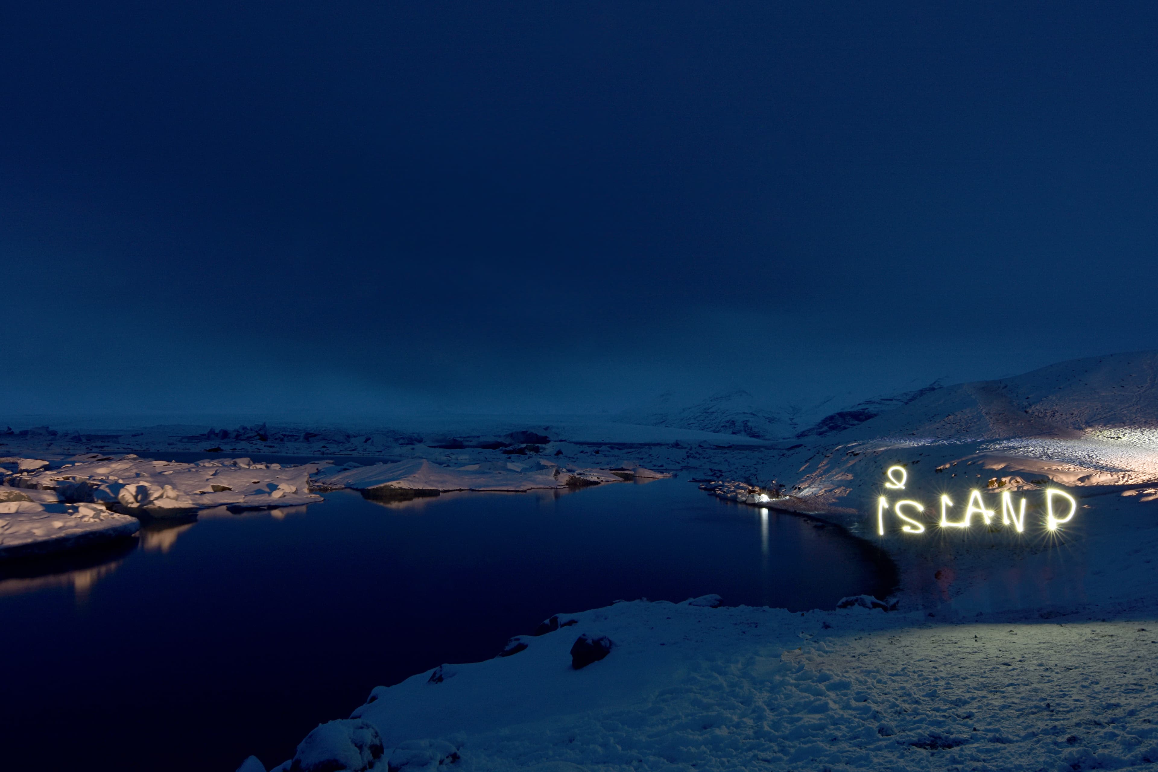 Glacier Lagoon and the mighty Öræfajökull glacier in Iceland, Europe. Lightning painting of Iceland in the Czech language. Lightning painting of Iceland in the Czech language in Glacier Lagoon and its mighty Öræfajökull glacier.