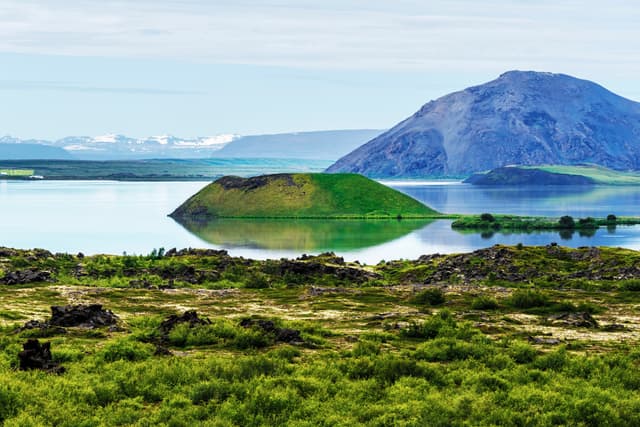 Landscape of Myvatn lake in Northern Iceland. Islet of volcanic pseudo crater is a middle. Landscape of Myvatn lake in Northern Iceland. Islet of volcanic pseudo crater is a middle.