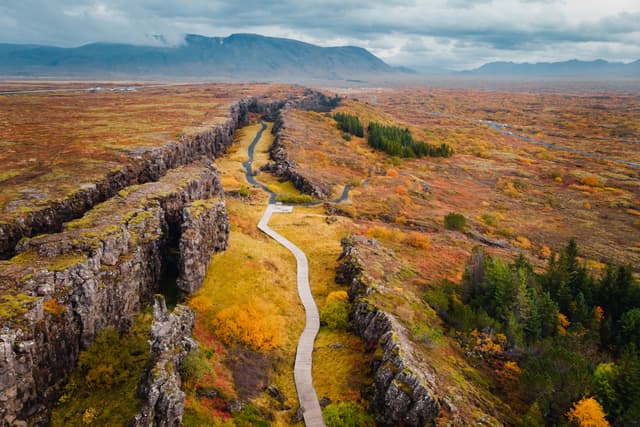 Aerial view autumn Icelandic landscape, rocky canyon on background of mountains Autumn landscape in Iceland, rocky canyon on background of mountain, drone shot