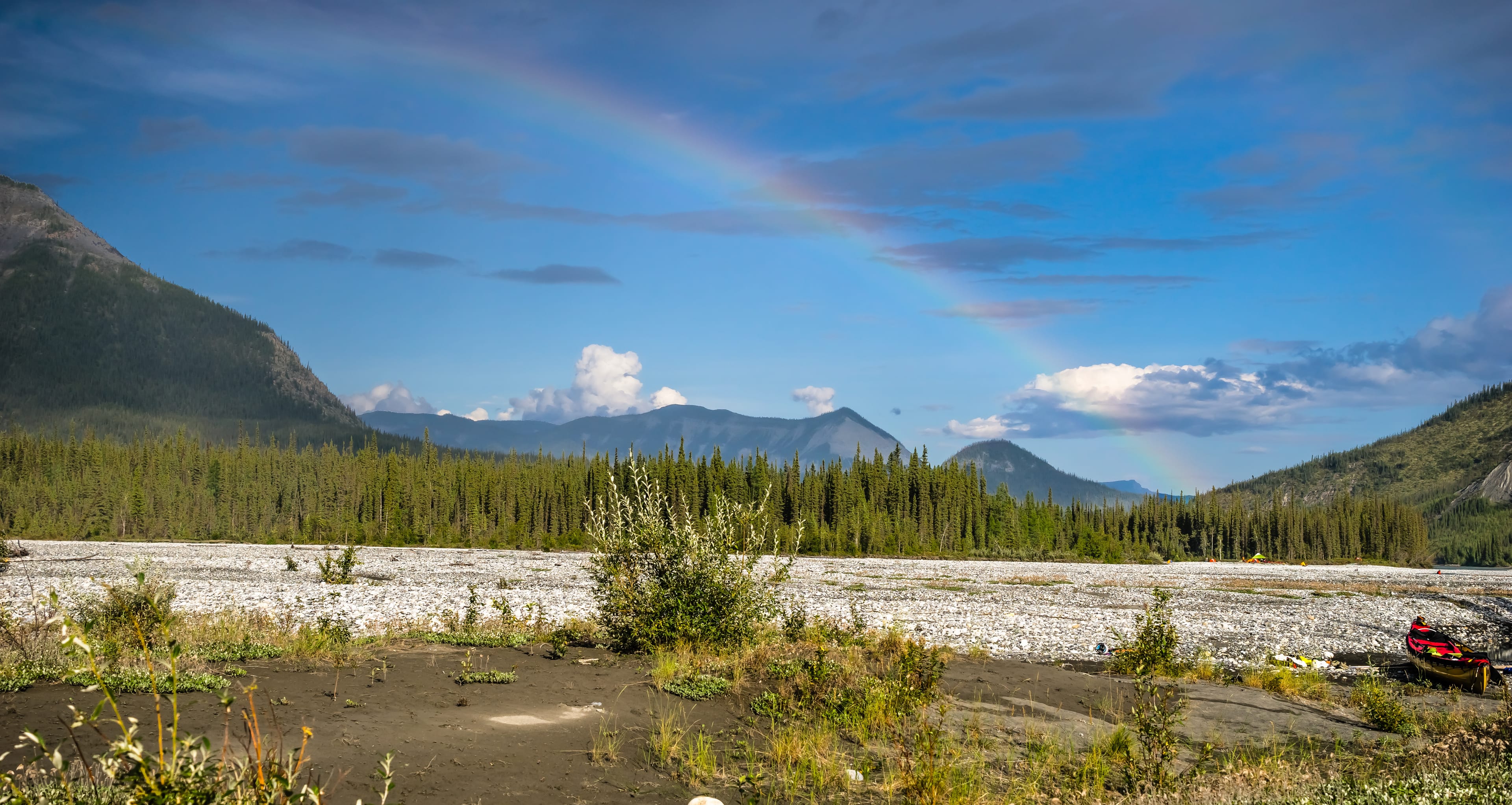 Rainbow in Nahanni river valley Rainbow splitting the sky