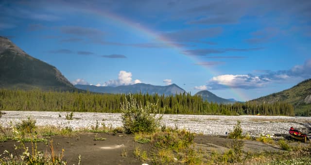 Rainbow in Nahanni river valley Rainbow splitting the sky