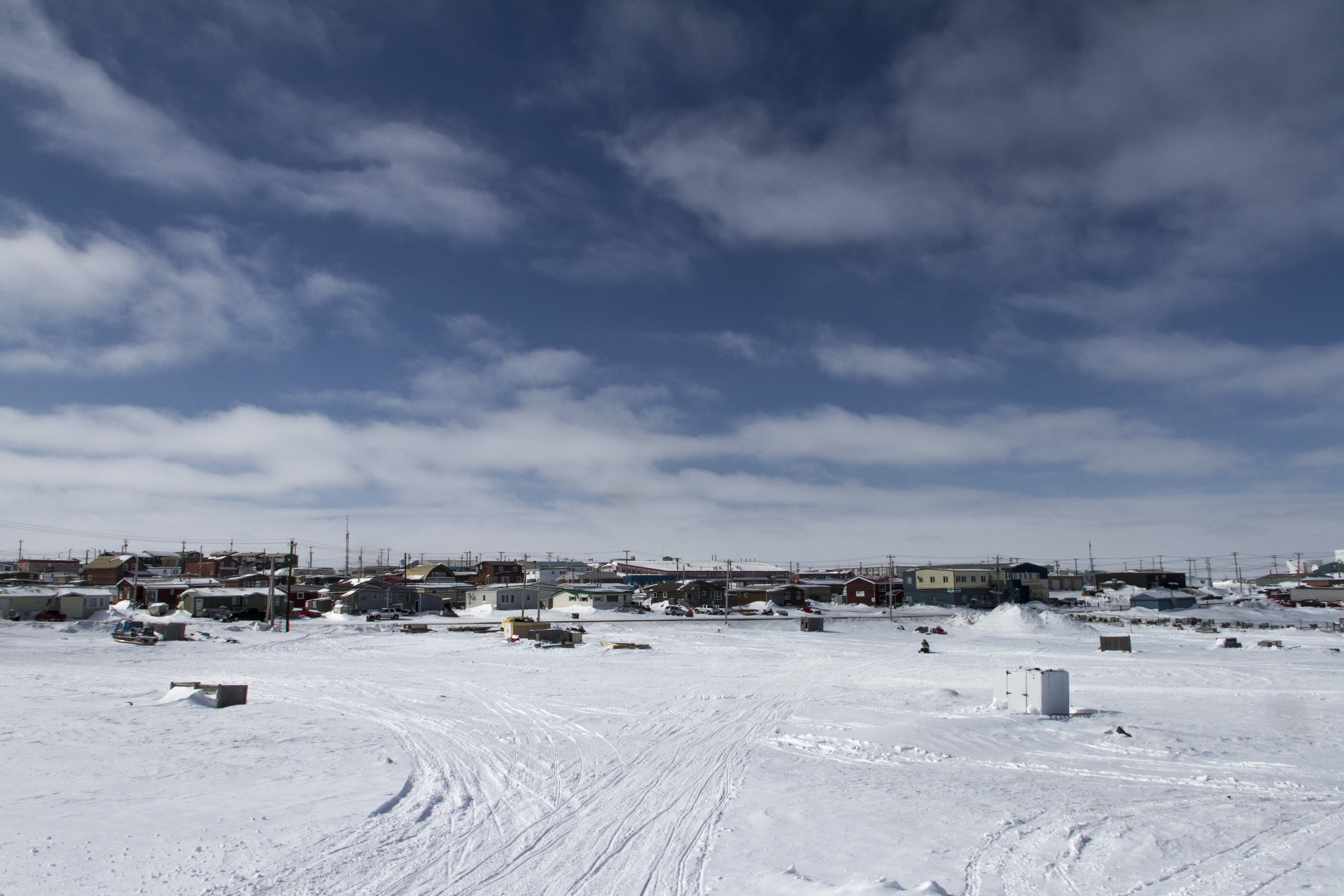 View of Rankin Inlet, a remote arctic community in Nunavut with blue skies and snow on the ground Nunavut Region 4