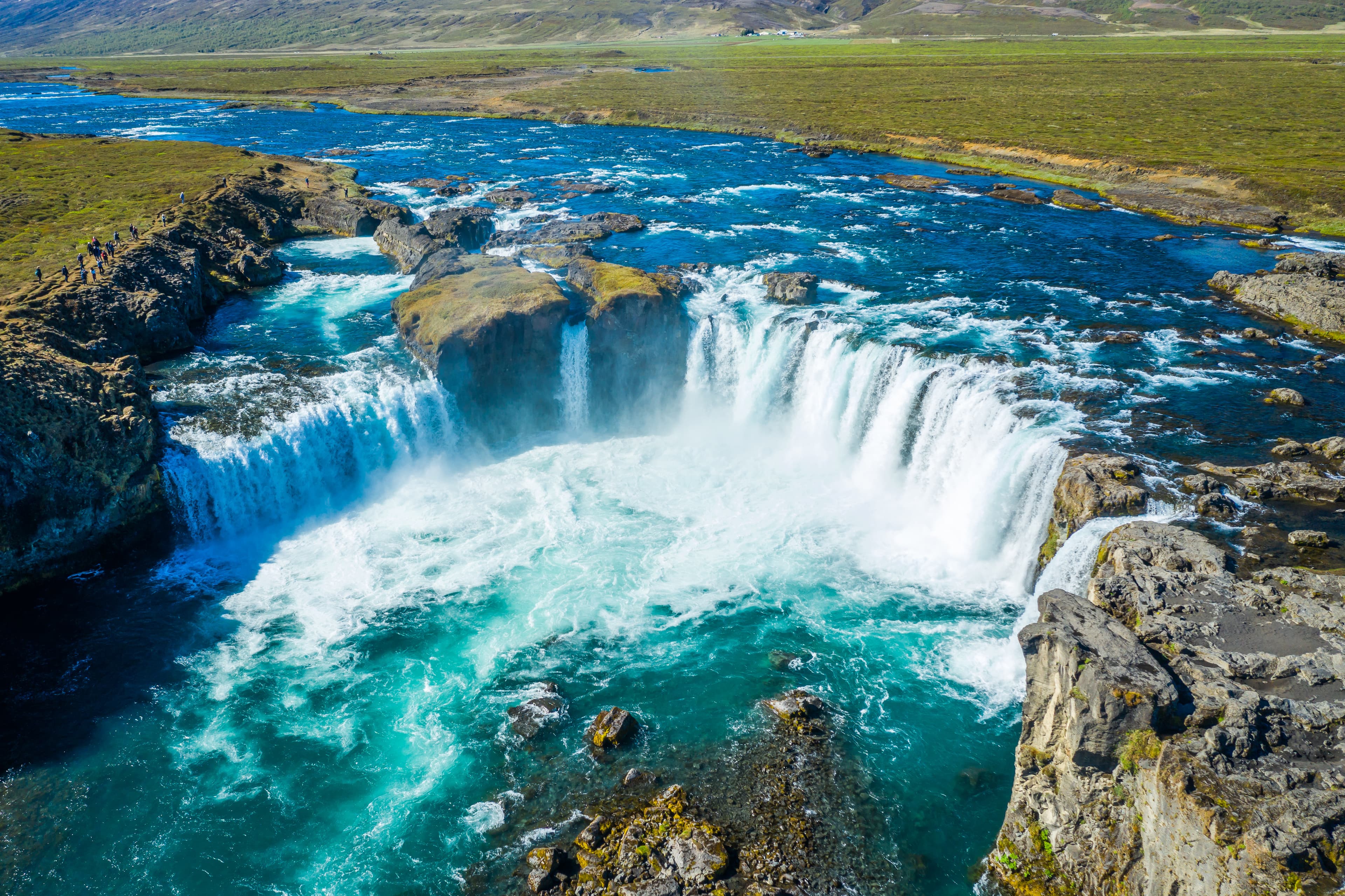 Incredible landscape scene of powerful Godafoss waterfall. Dramatic sky over Godafoss. Aerial view landscape of the Godafoss famous waterfall in Iceland.