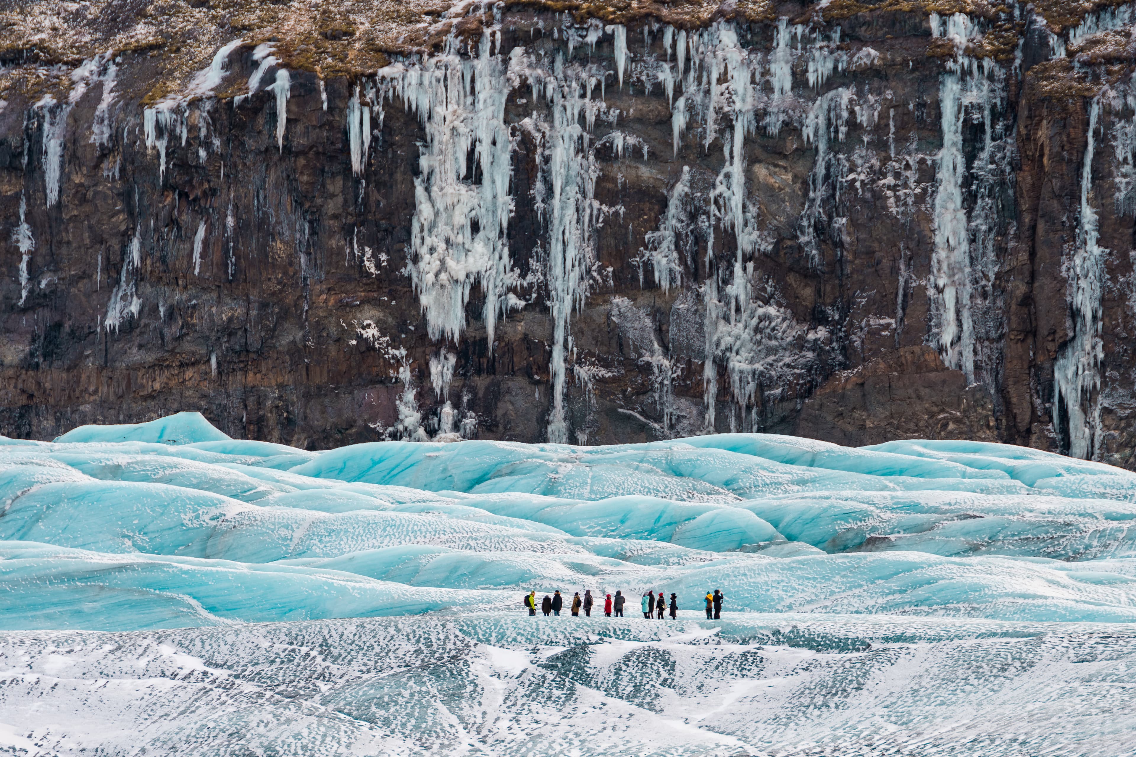 group-of-people-hiking-on-glacier-in-iceland-mountain