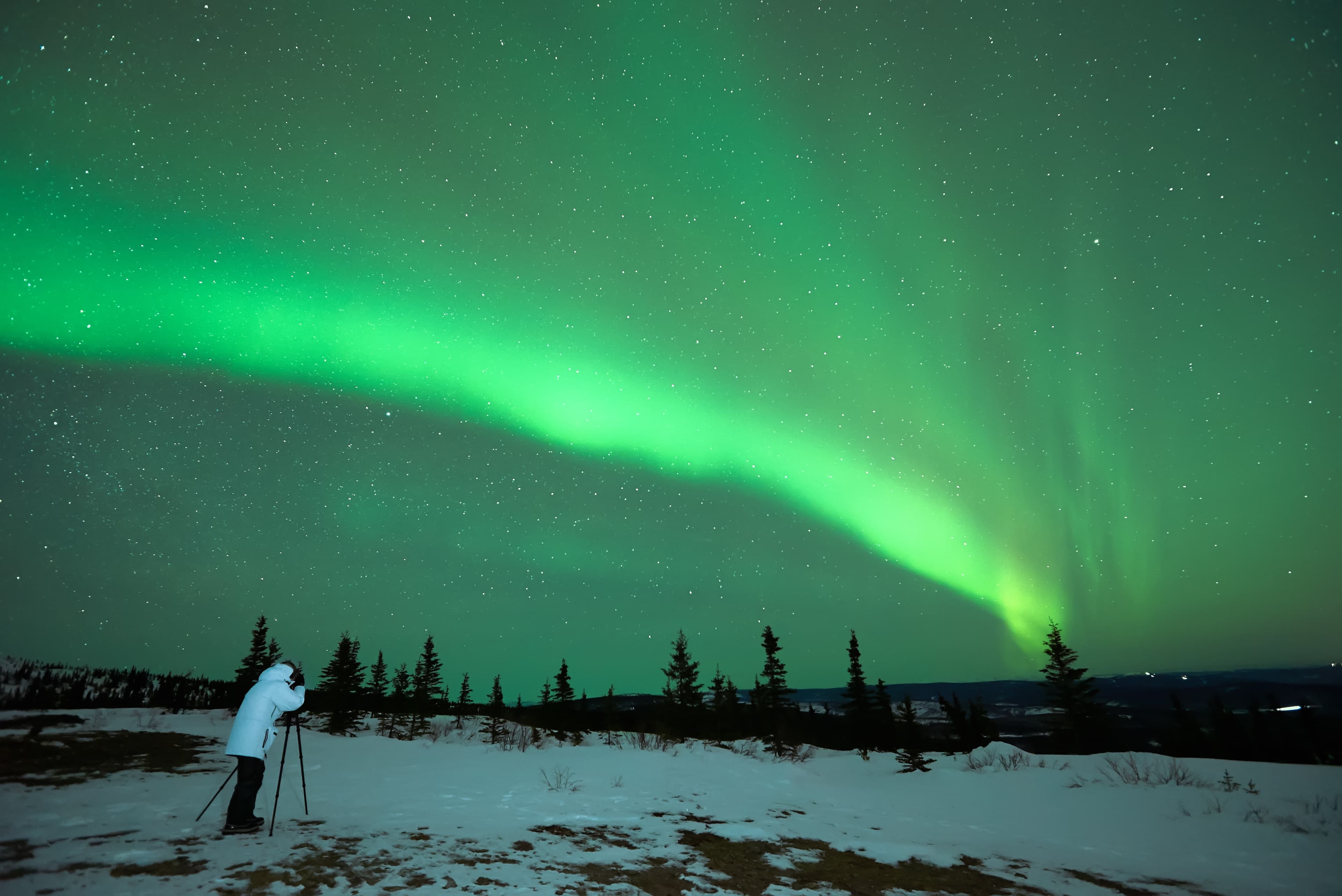 22.3.15 Wickersham Dome. Alaska.  Man photographing the Aurora Borealis in Alaska