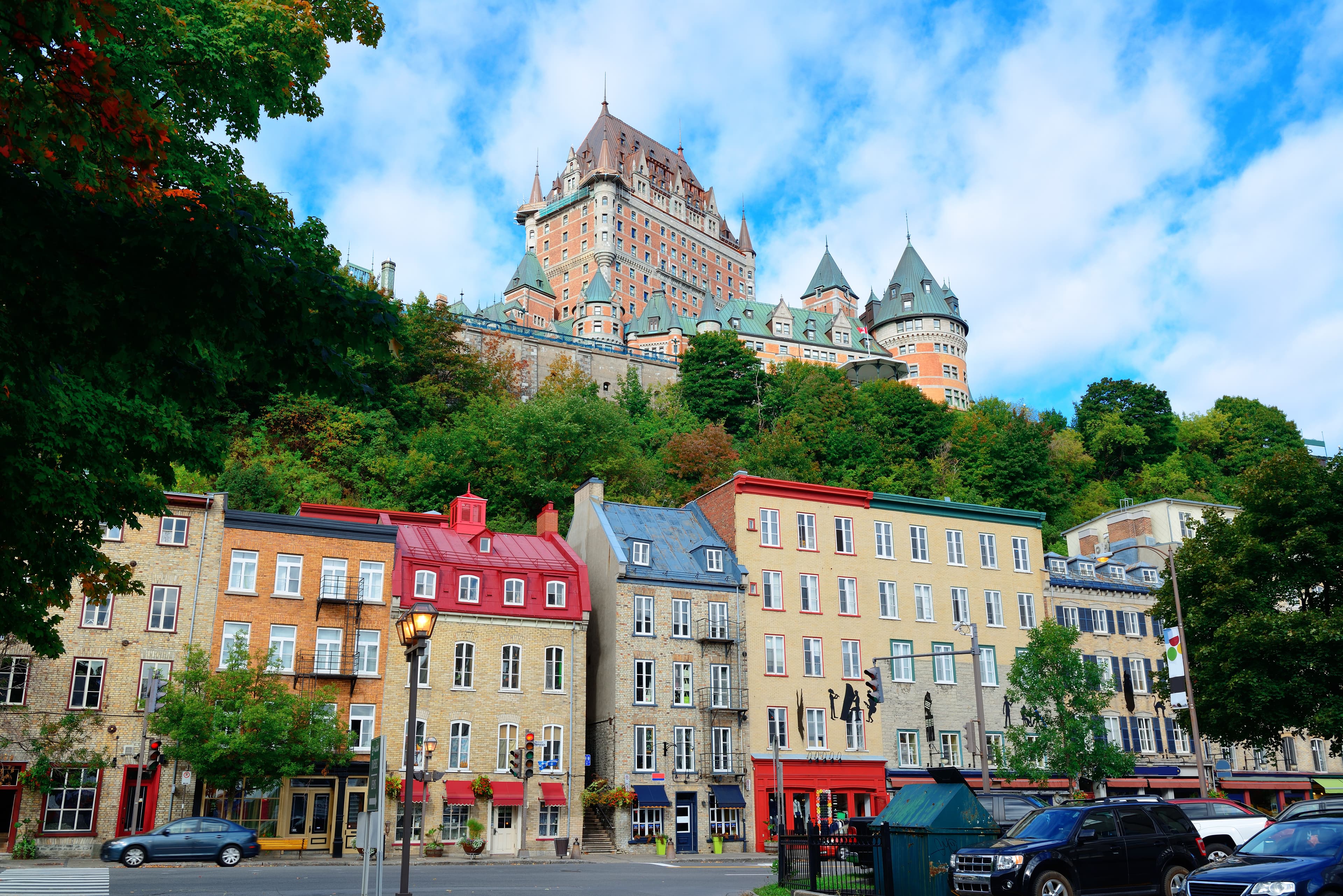 Chateau Frontenac in the day with colorful buildings on street in Quebec City Chateau Frontenac Quebec City Canada