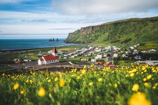 Beautiful town of Vik i Myrdal in Iceland in summer. The village of Vik  is the southernmost village in Iceland on the ring road around 180 km southeast of Reykjavík. Beautiful town of Vik i Myrdal Iceland in summer.