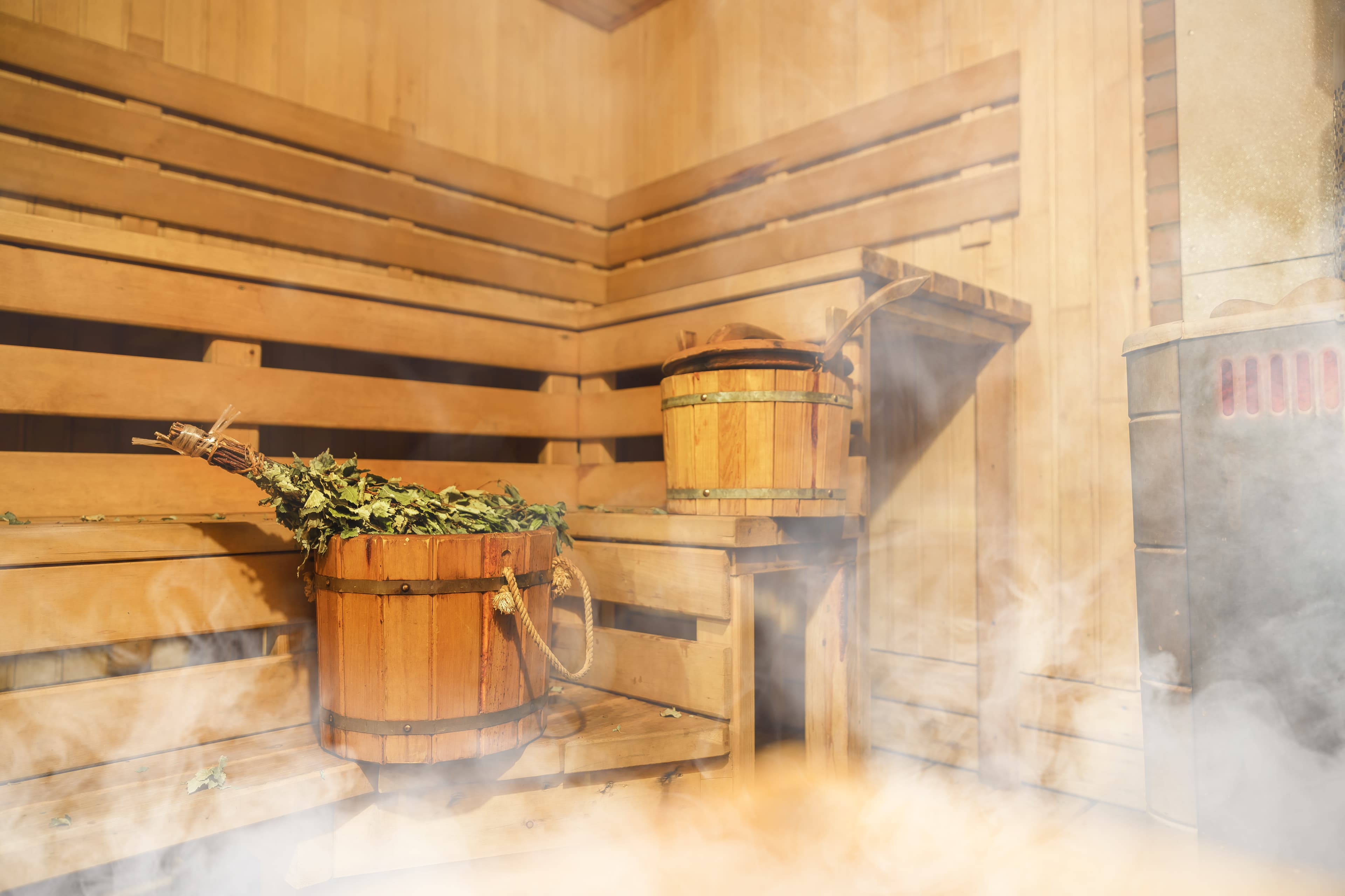 Interior of Finnish sauna, classic wooden sauna, Finnish bathroom, Relax in hot sauna with steam Interior of Finnish sauna, classic wooden sauna, Relax in hot sauna