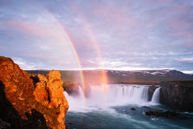Godafoss waterfall. Famous Tourist Attraction. Summer landscape with a rainbow Godafoss - one of the Iceland waterfalls