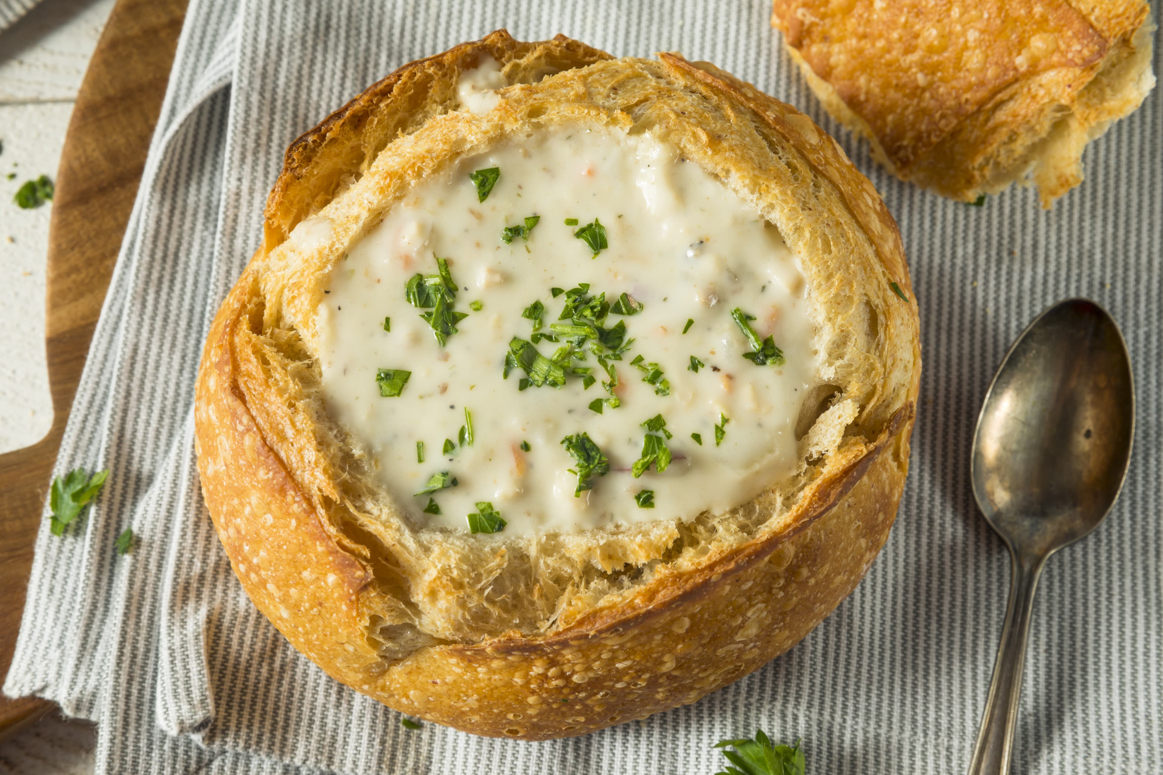 New England Clam Chowder in a Bread Bowl with Parsley New England Clam Chowder in a Bread Bowl
