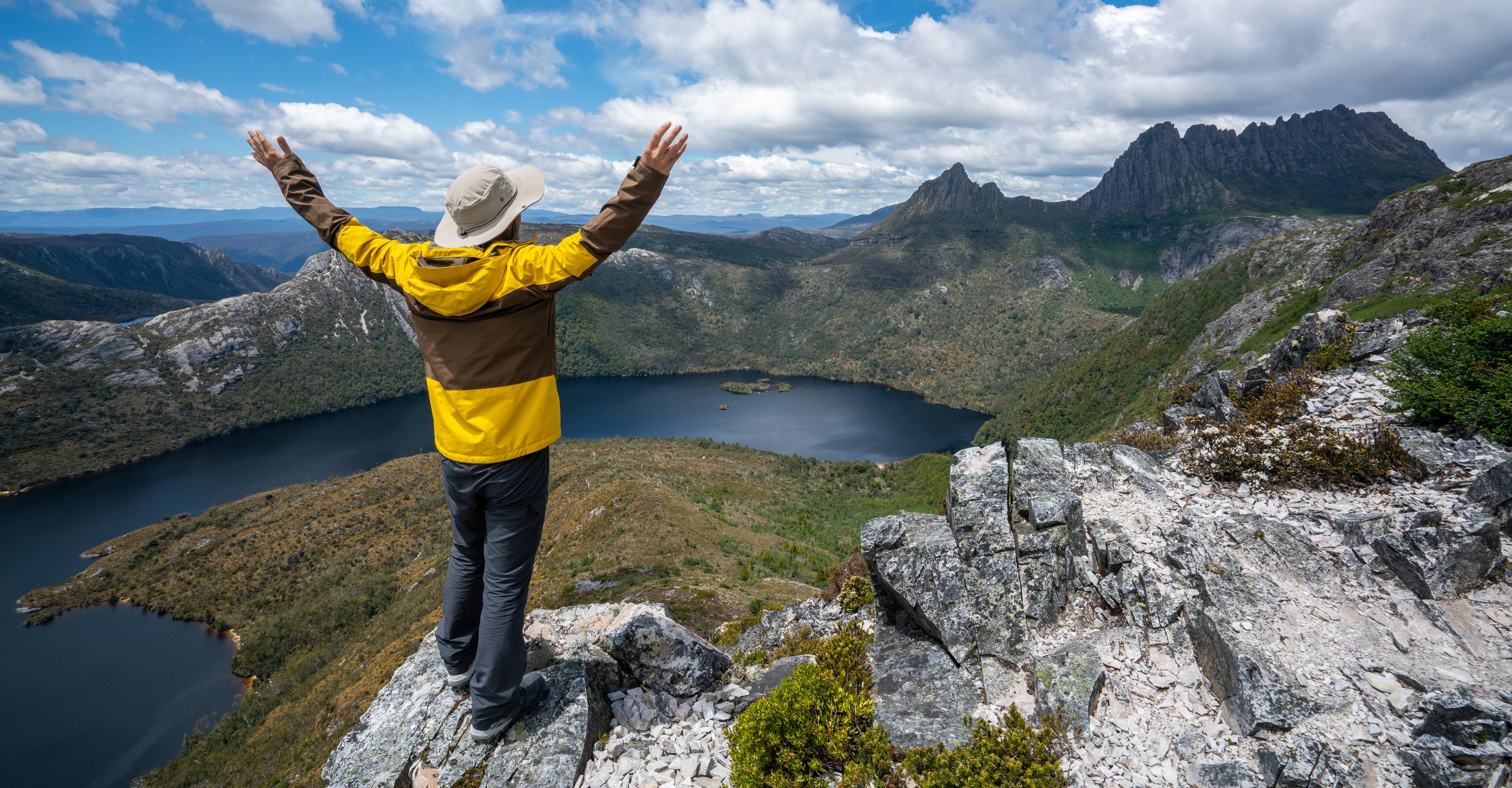 Traveller man explore landscape of Marions lookout trail in Cradle Mountain National Park in Tasmania, Australia. Summer activity and people adventure. Traveller man explore landscape of Marions lookout trail in Cradle Mountain National Park in Tasmania, Australia. Summer activity and people adventure.