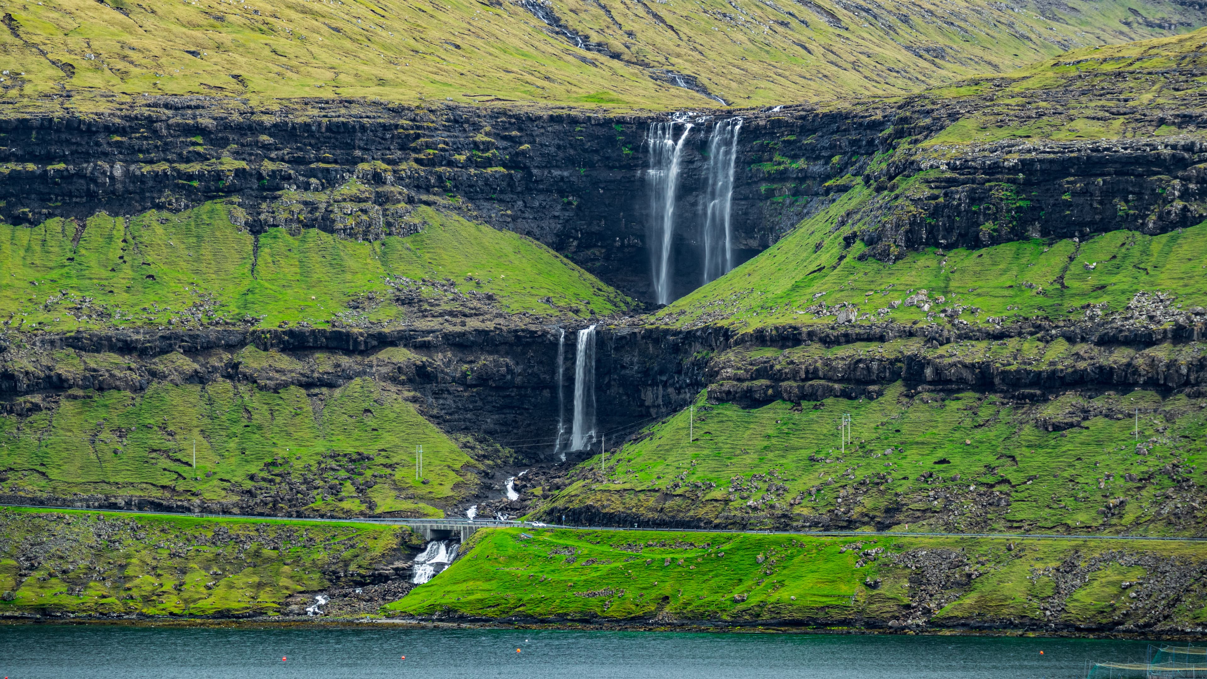 Long shot of whole Fossa waterfall in Faroe Islands Long shot of Fossa waterfall in Faroe Islands