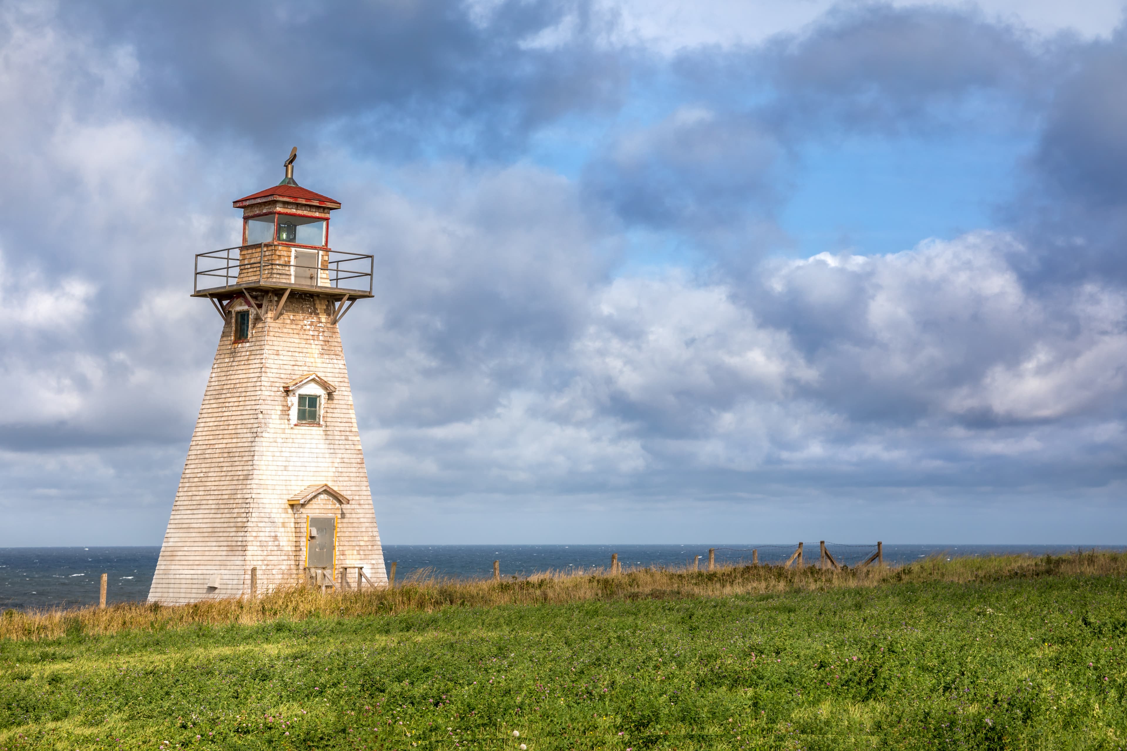 Cape Tryon Lighthouse, Northwest coast of Prince Edward Island, Canada. An historic wooden automated lighthouse sitting above the Gilf of St Lawrence. Cape Tryon Lighthouse, Northwest coast of Prince Edward Island
