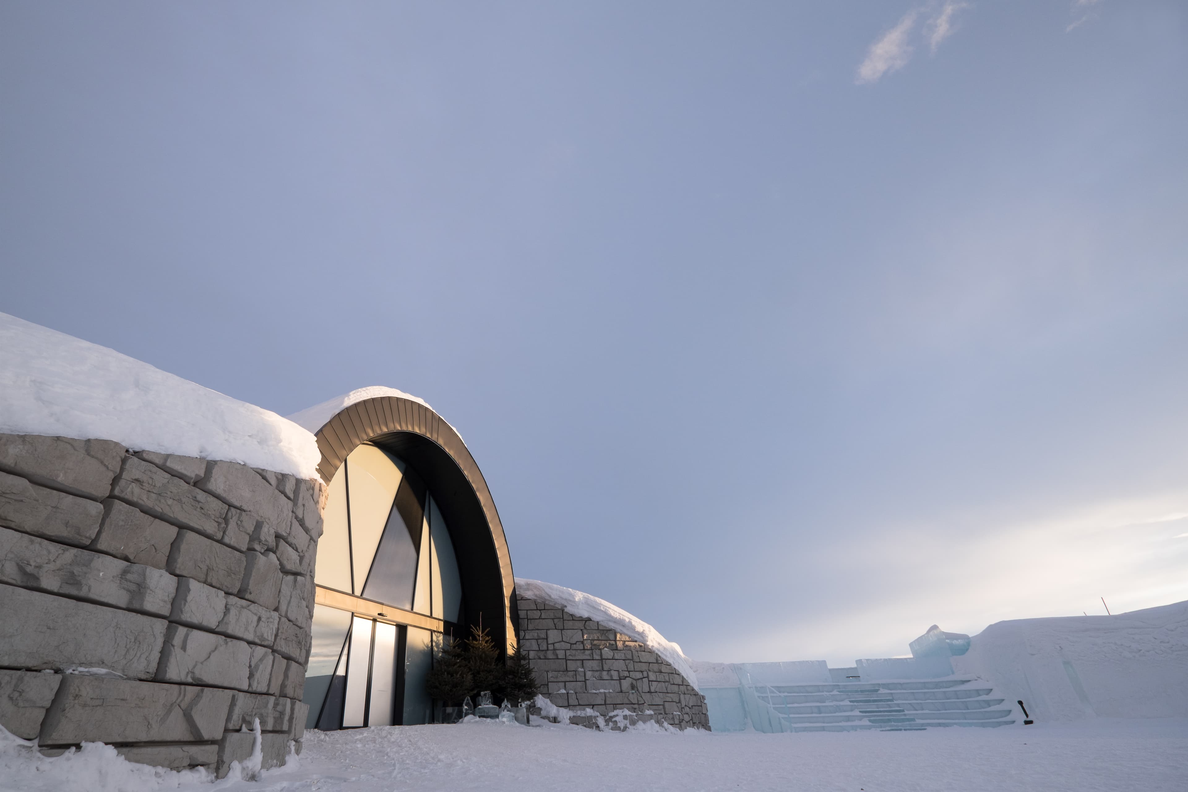 KIRUNA, SWEDEN - MARCH 15 2020: Entrance to the Icebar and Icehotel 365 with the ice stairs of the famous Ice hotel near Kiruna in Jukkasjarvi, Sweden with sunset