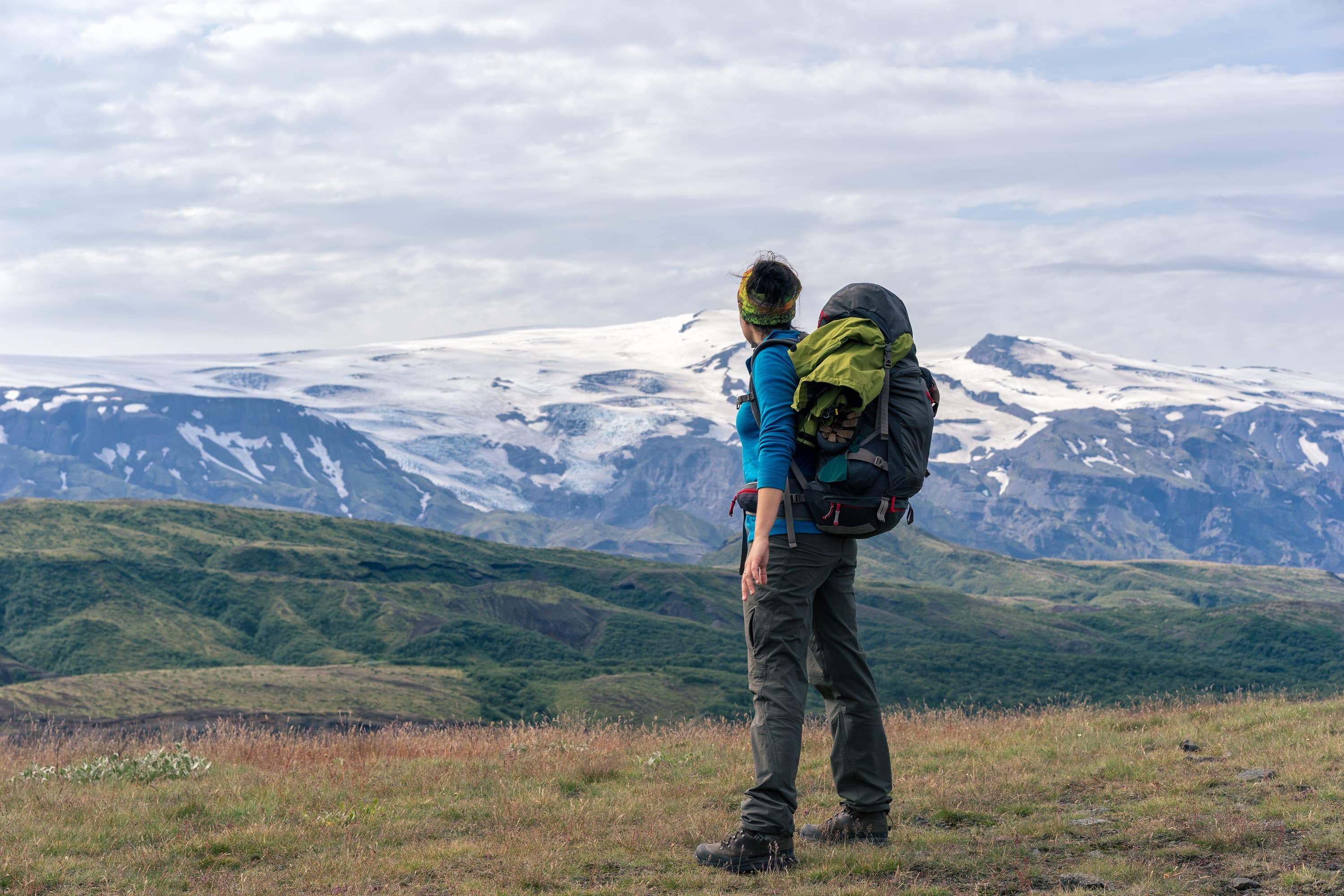 Female hikers enjoying scenic view of Eyjafjallajökull vulcano. Þórsmörk National Park. Female hikers enjoying scenic view of Eyjafjallajökull vulcano. Þórsmörk National Park.